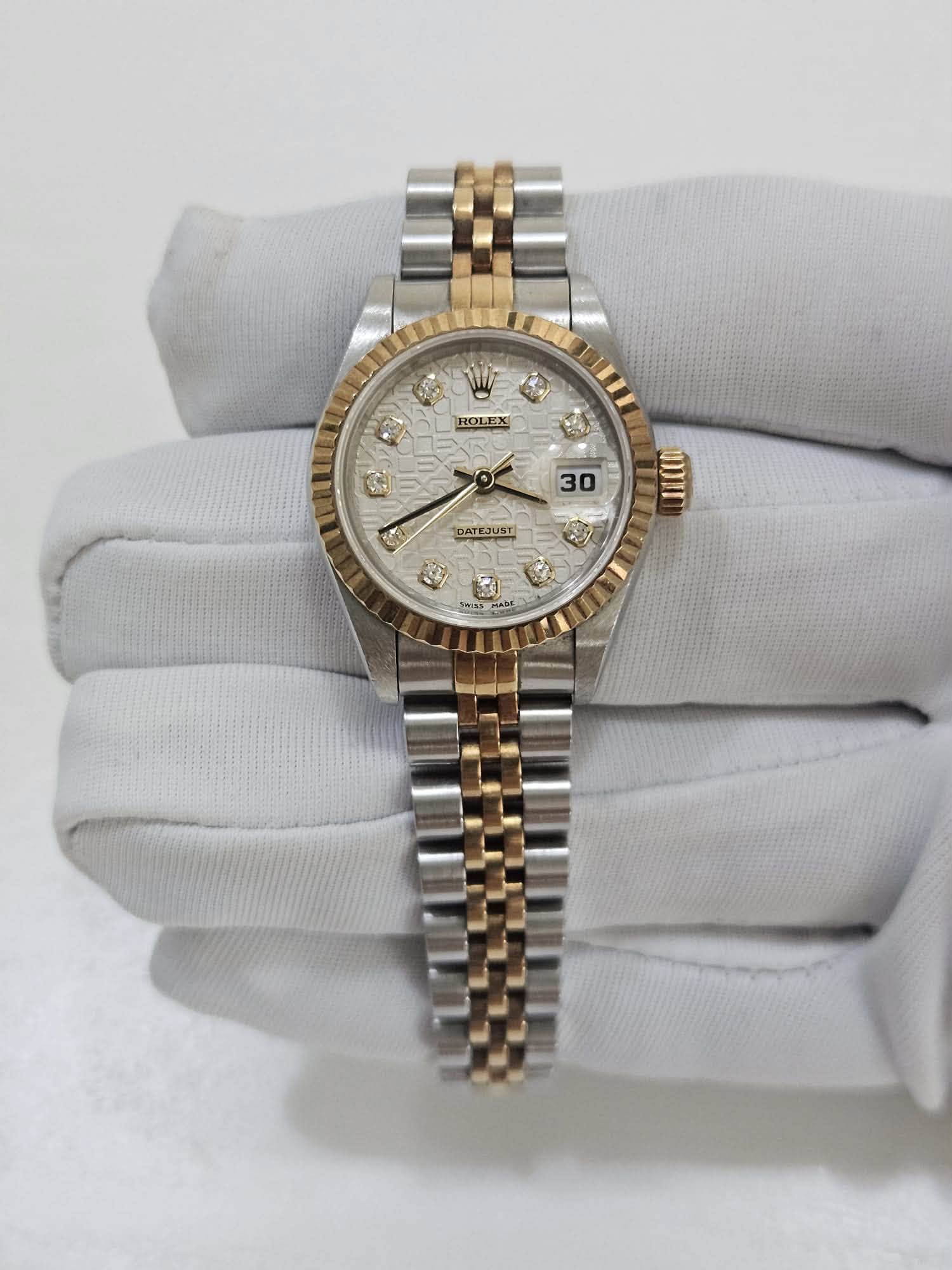 May be an image of wrist watch and text
