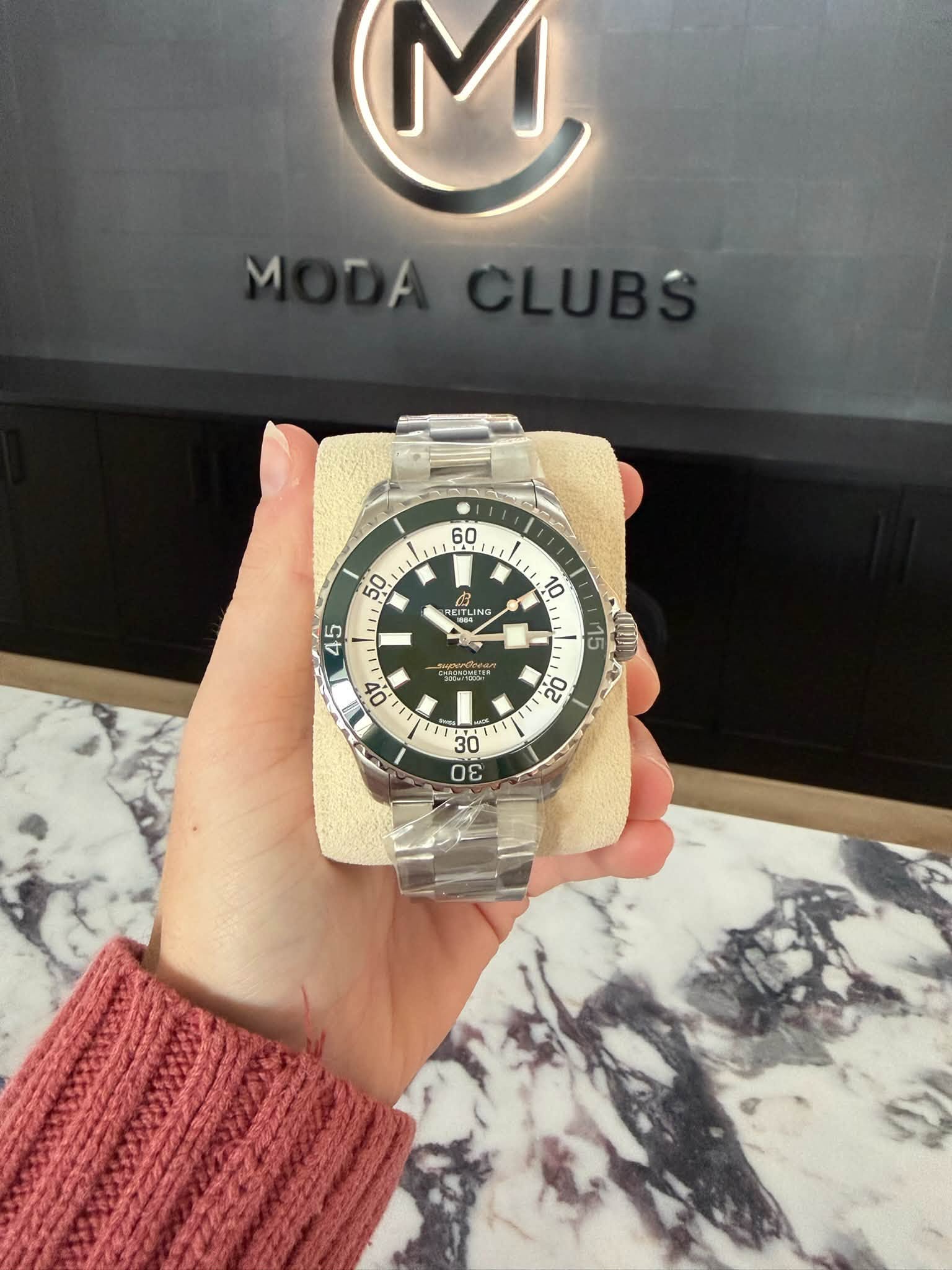 May be an image of wrist watch and text