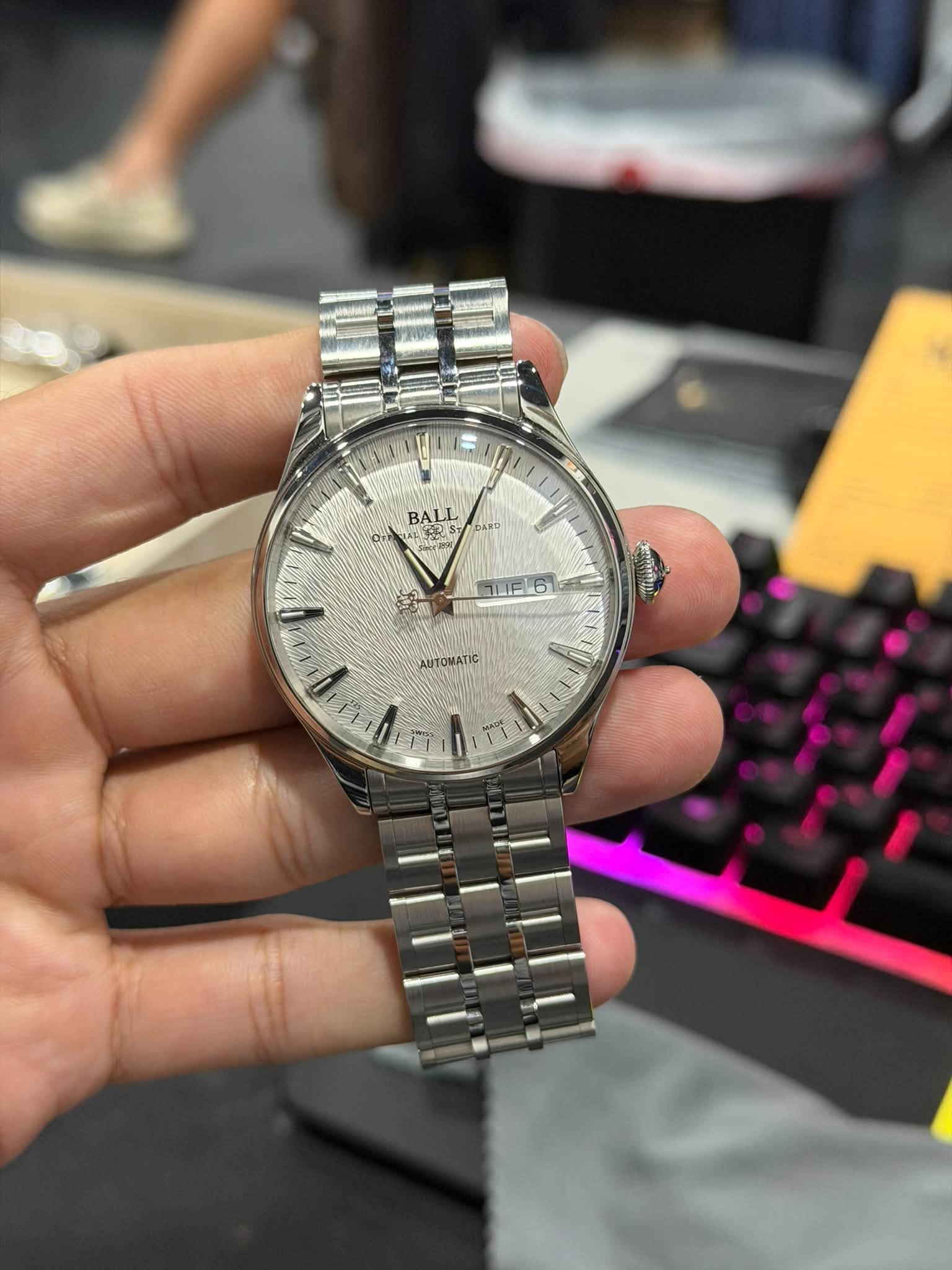 May be an image of wrist watch and text