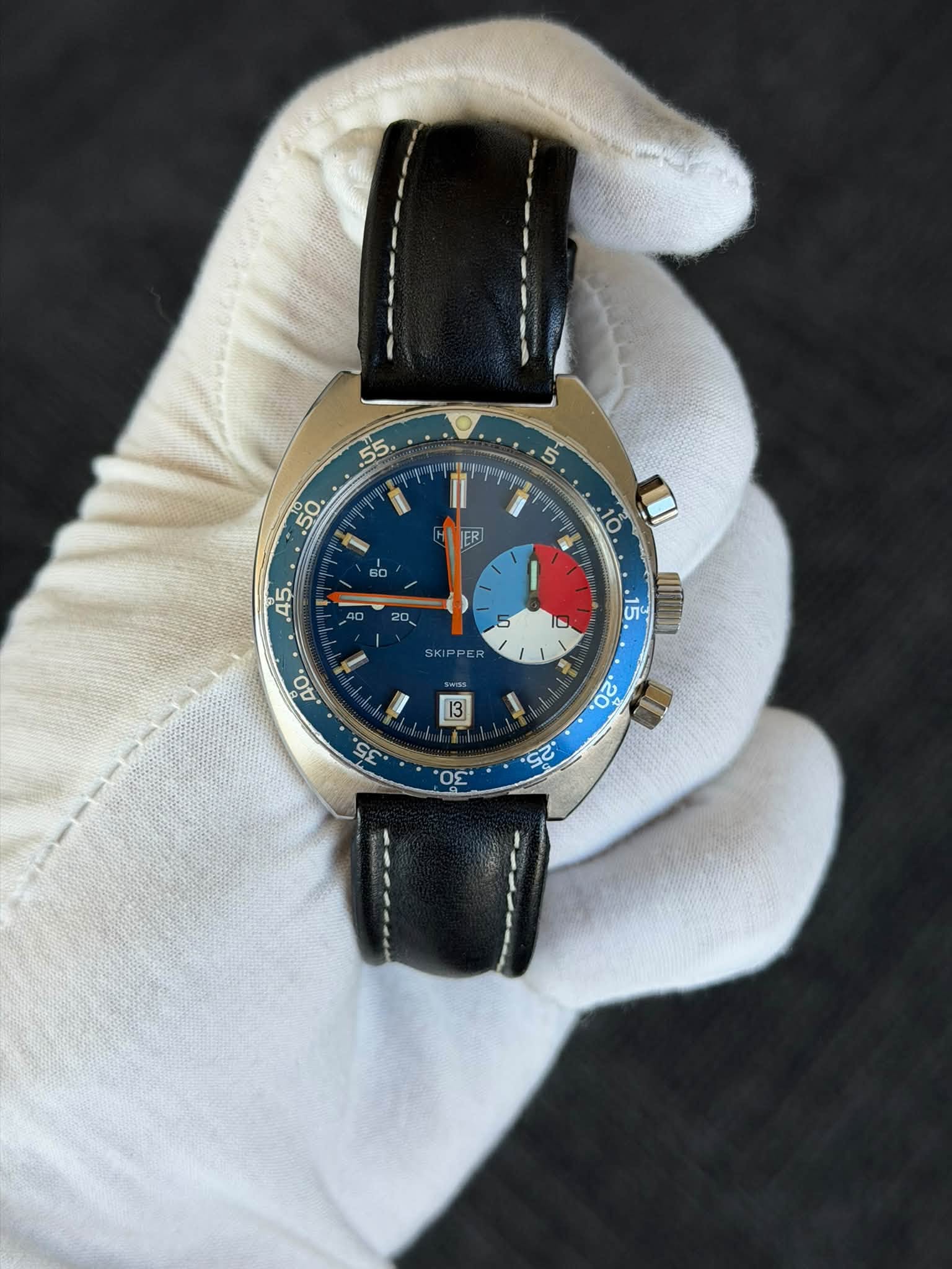 May be an image of wrist watch and text