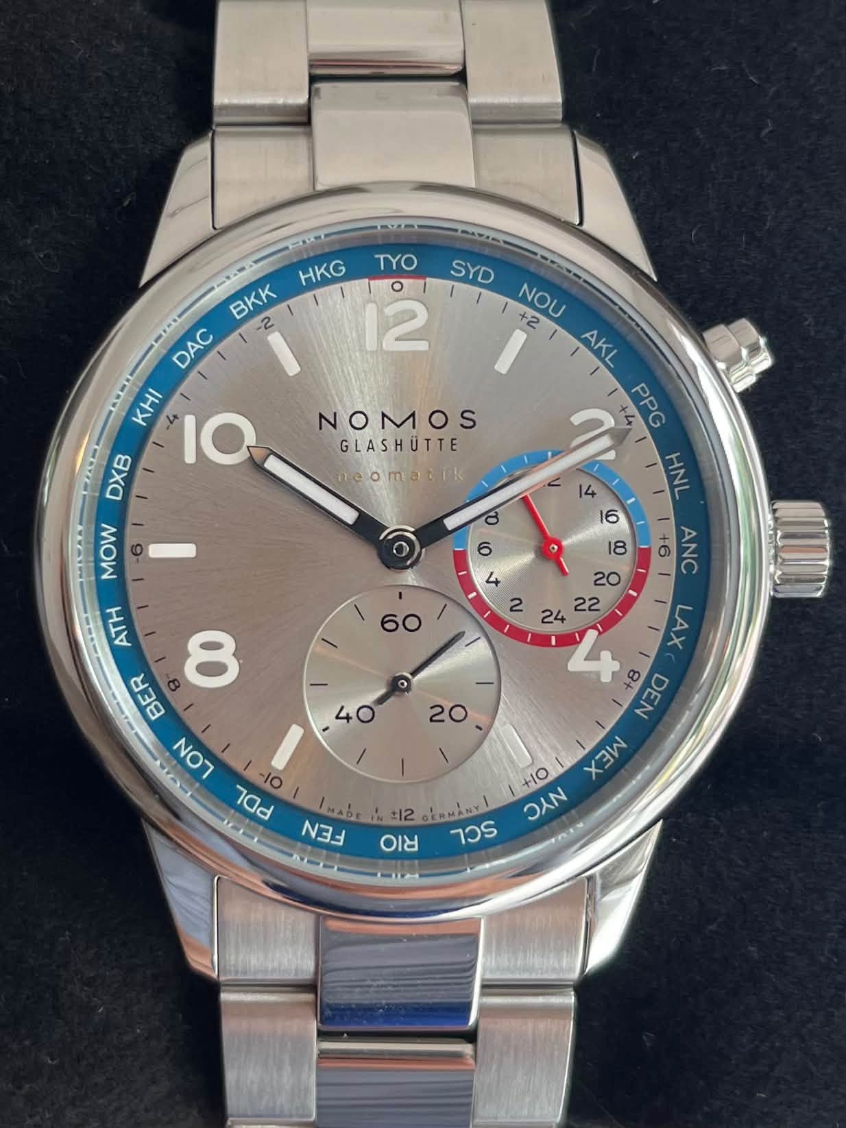 May be an image of wrist watch and text