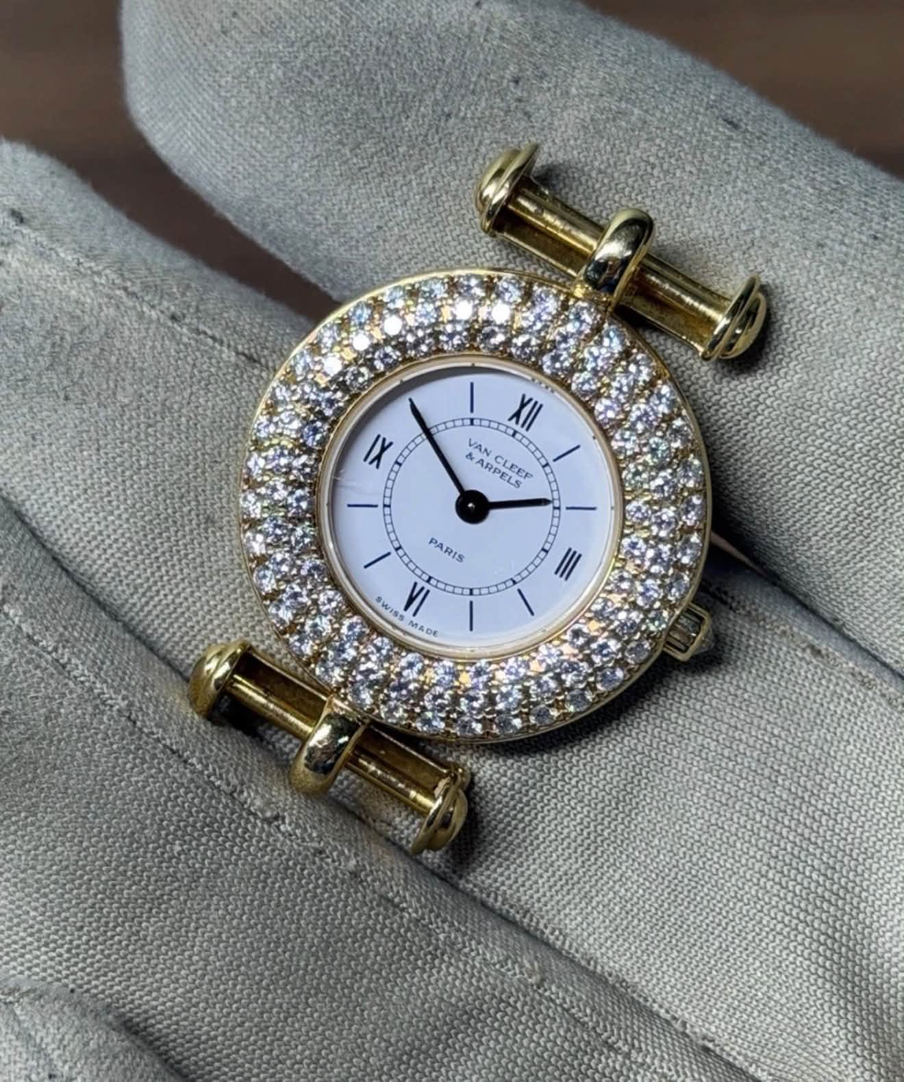 May be an image of cufflinks, wrist watch and text