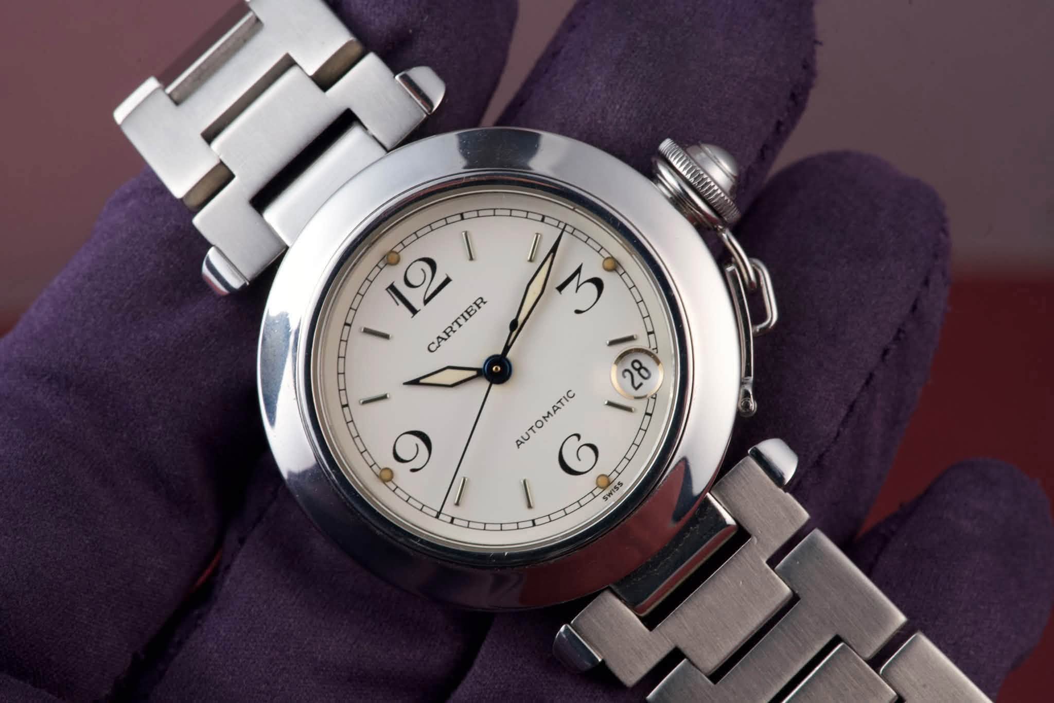 May be an image of wrist watch and text