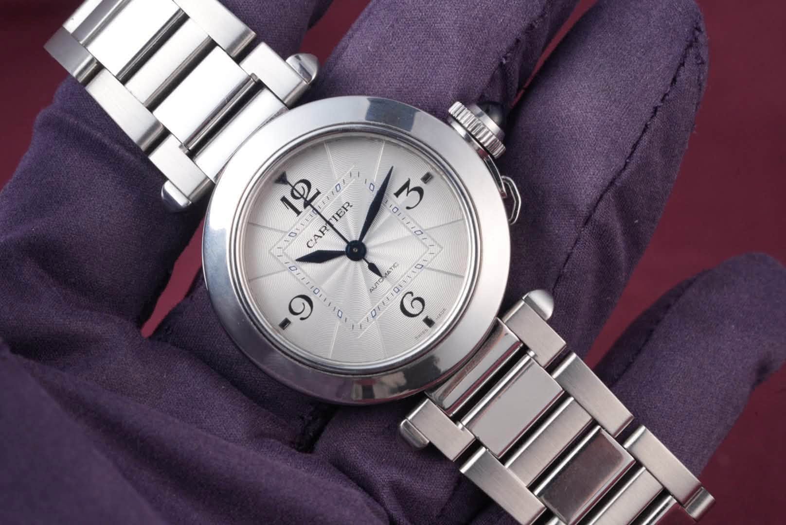 May be an image of wrist watch and text