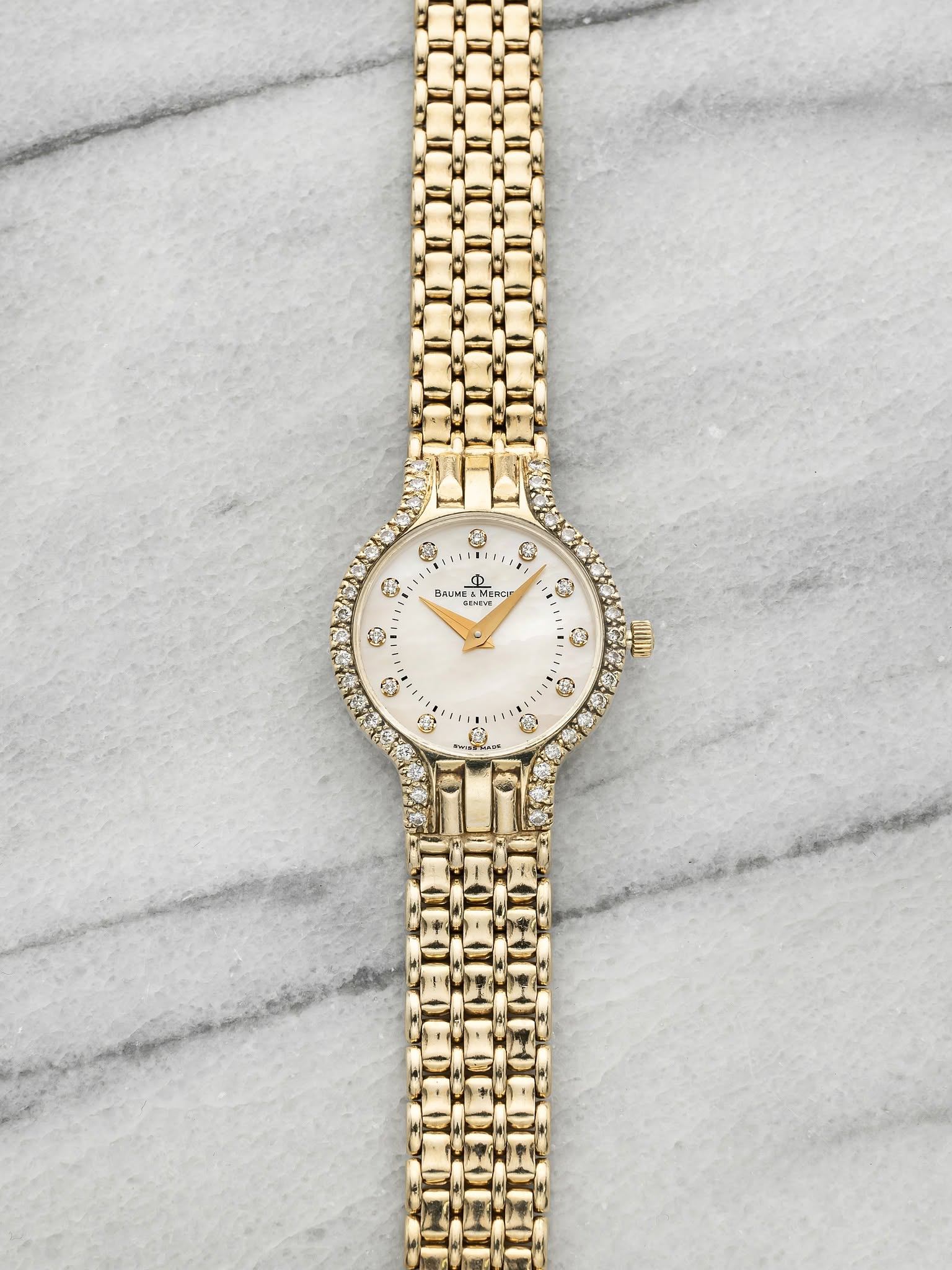 May be an image of jewelry and wrist watch