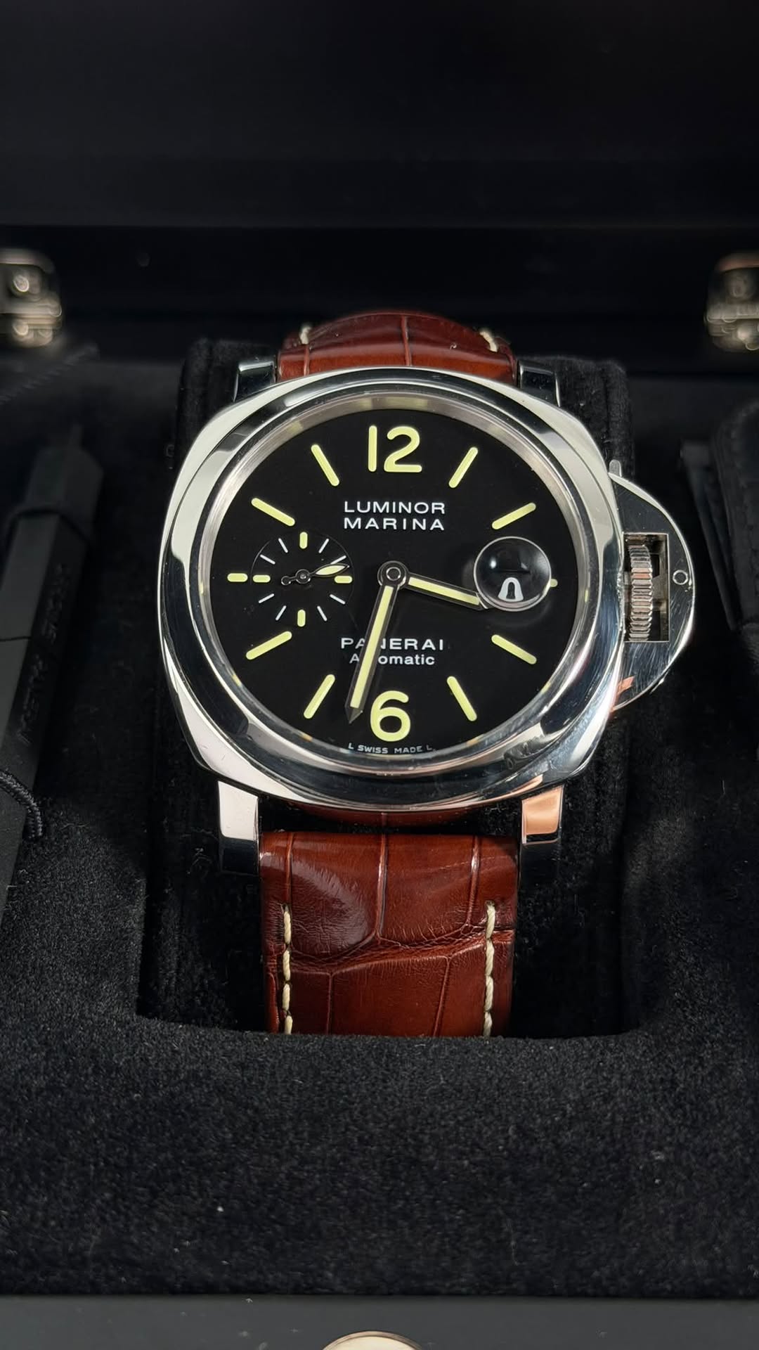 May be an image of wrist watch and text