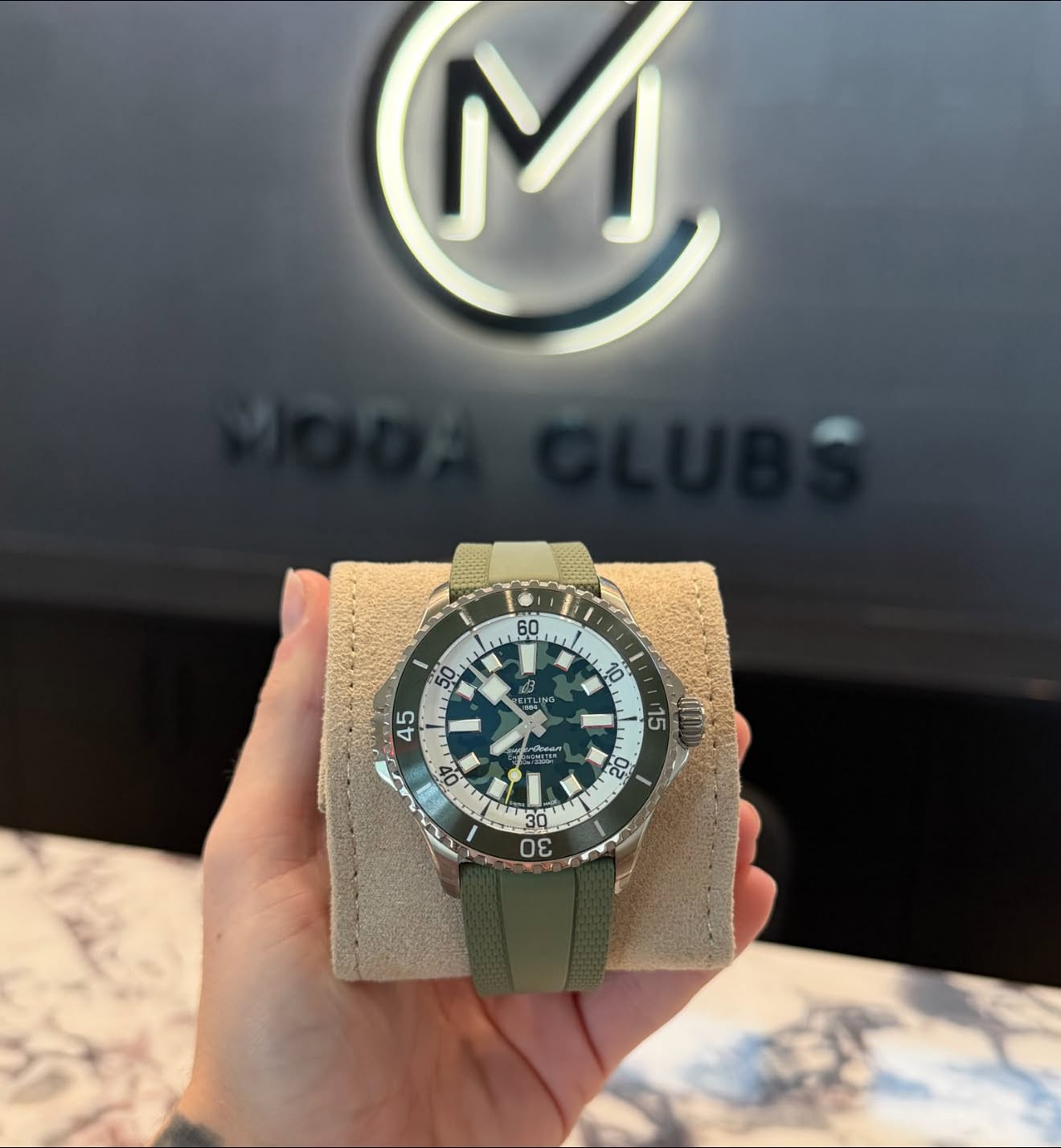 May be an image of wrist watch and text