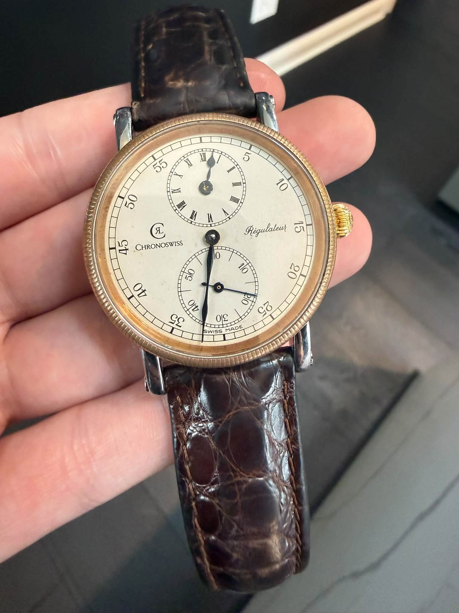 May be an image of wrist watch and text