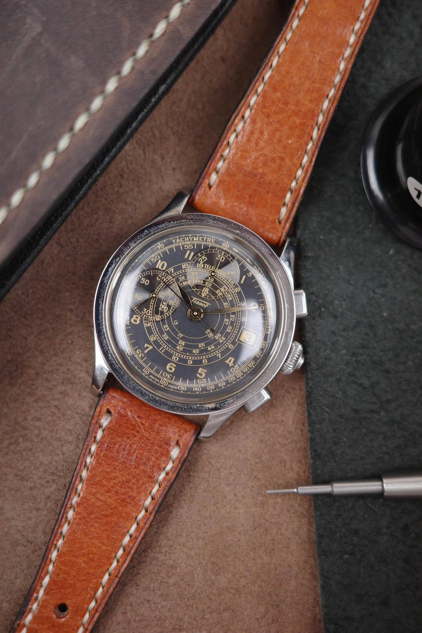 May be an image of wrist watch and text