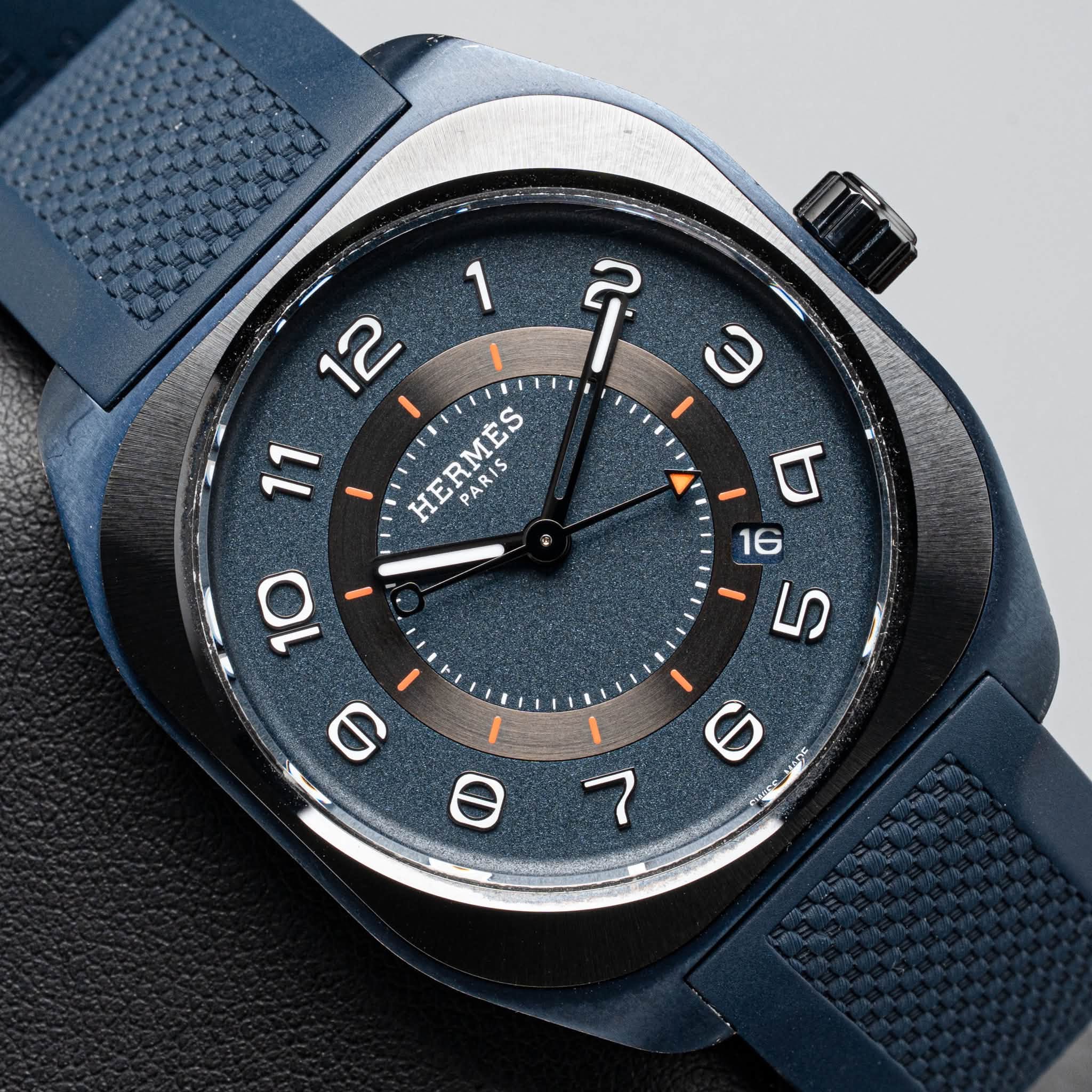 May be an image of wrist watch and text