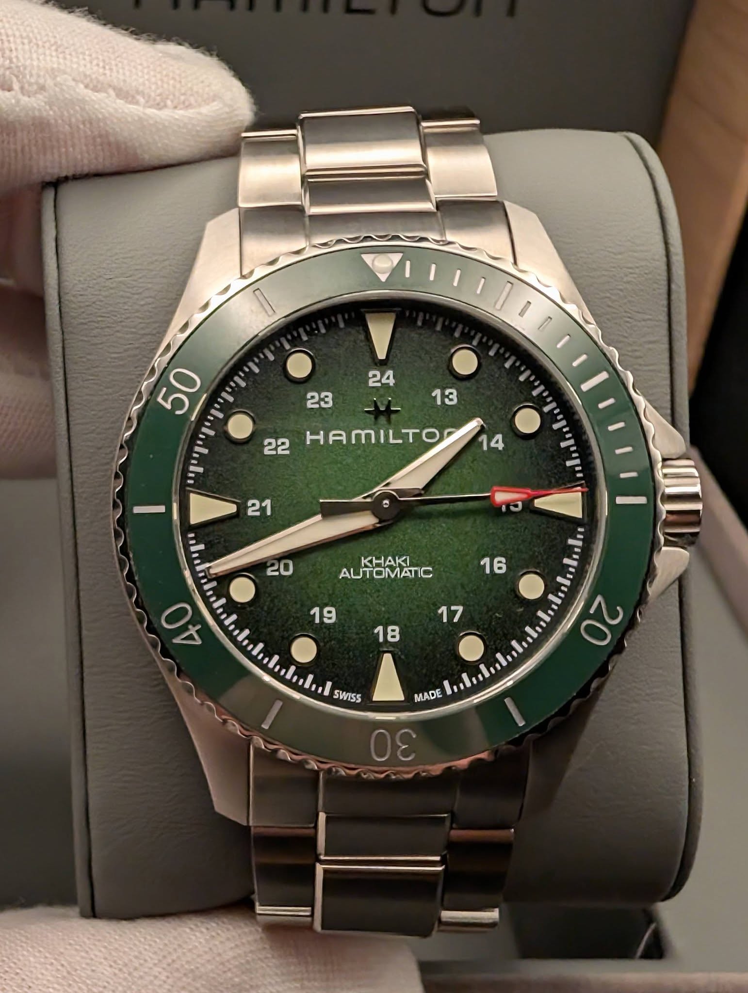May be an image of wrist watch and text