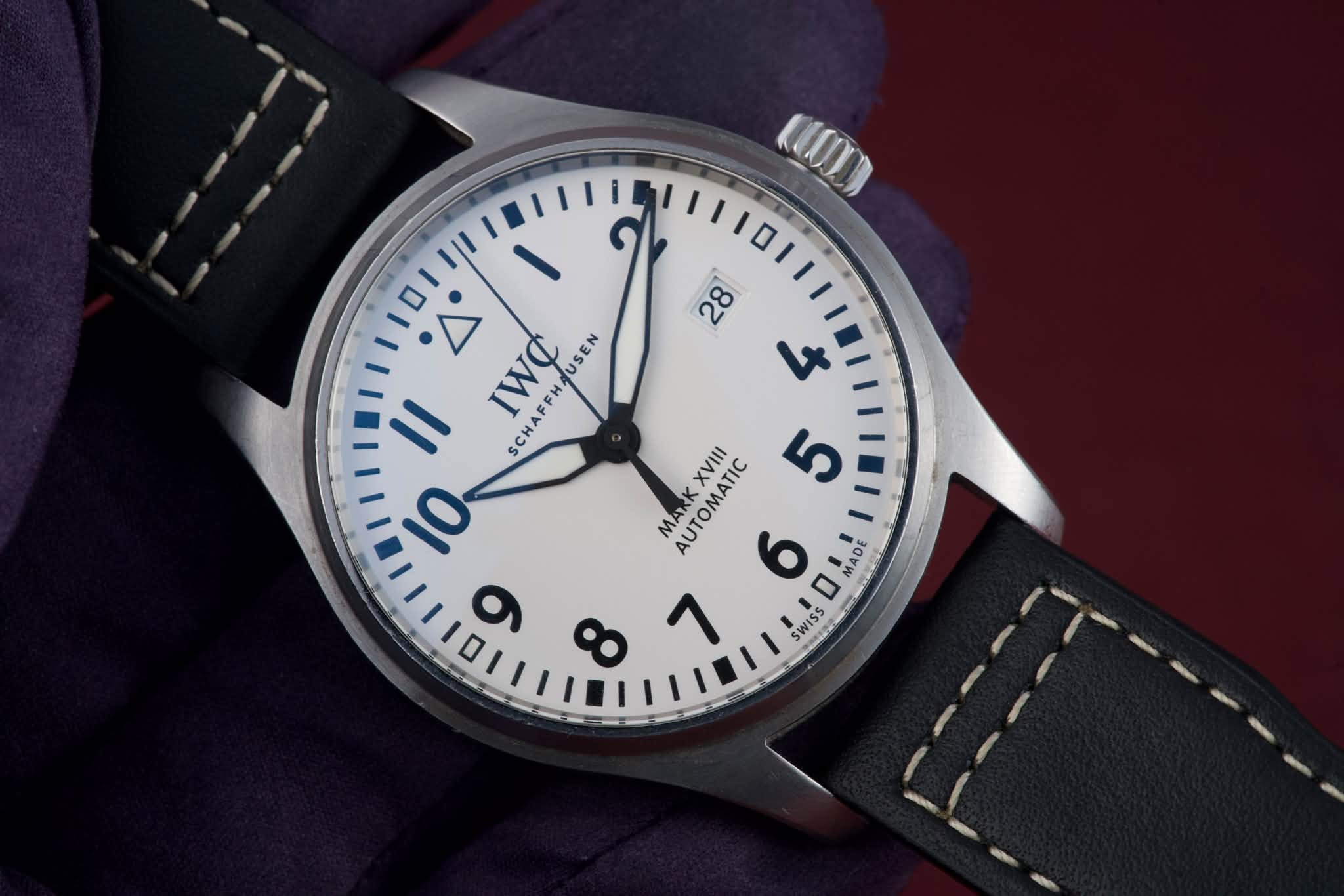 May be an image of wrist watch and text