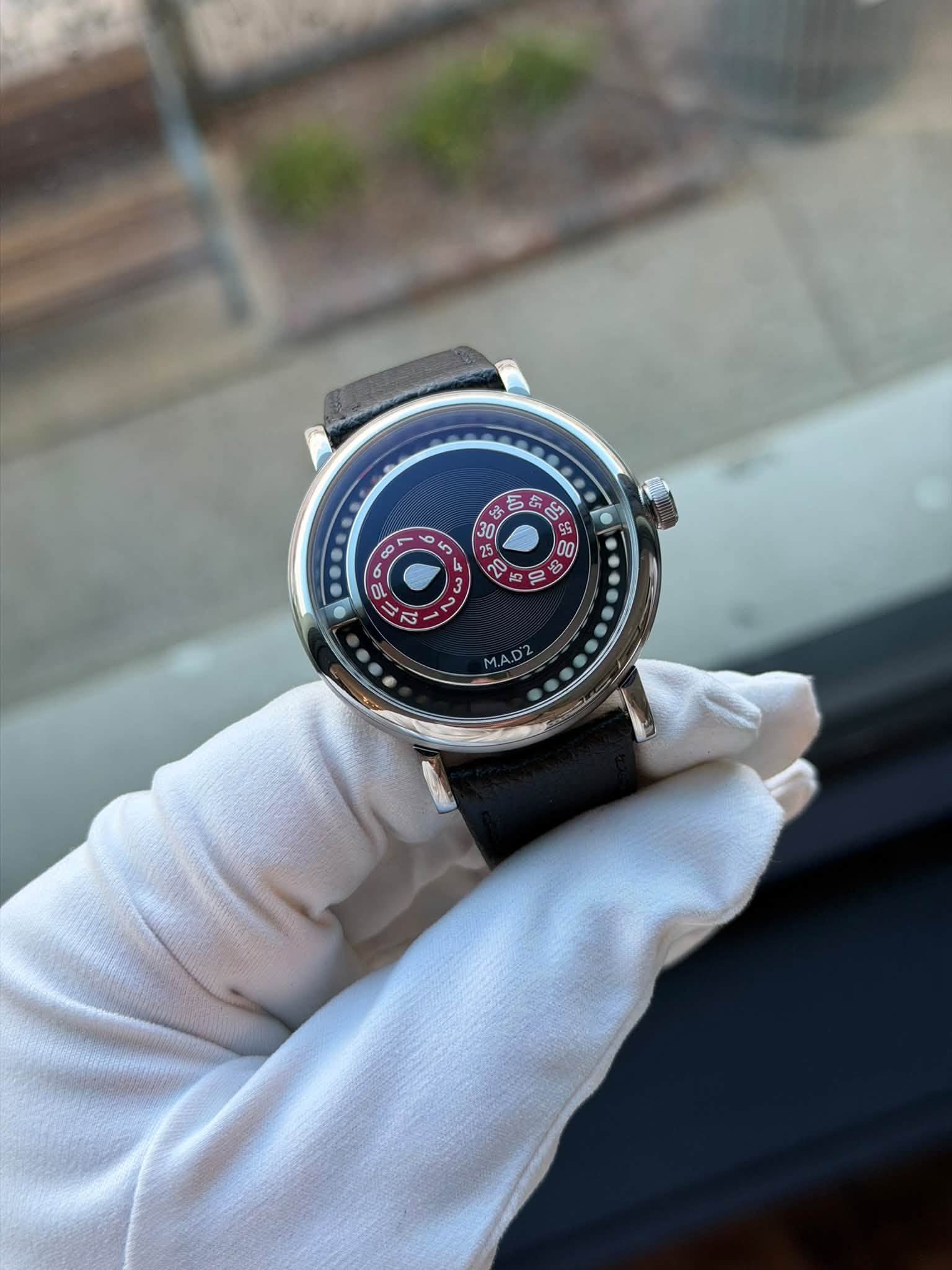 May be an image of wrist watch and text