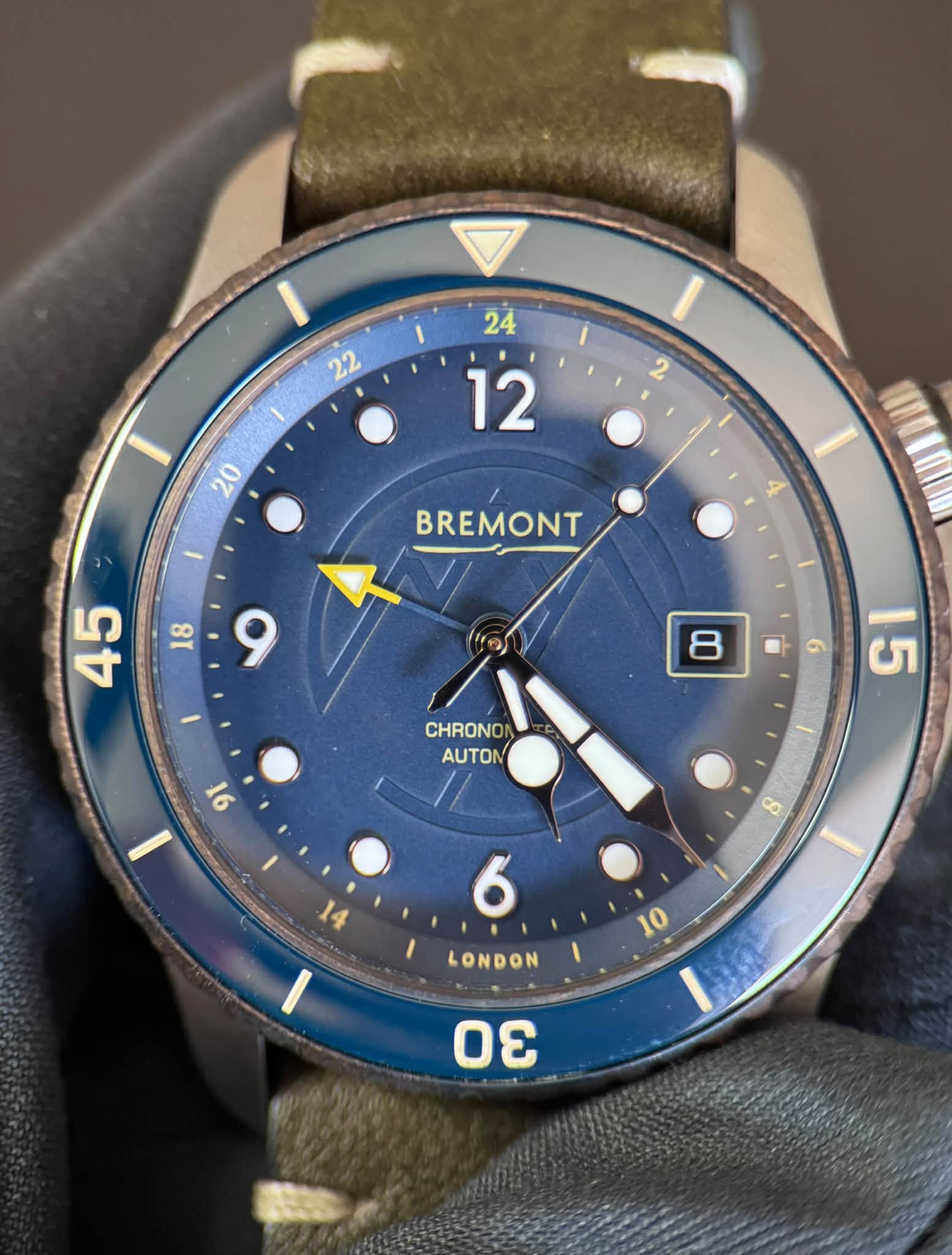May be an image of wrist watch and text