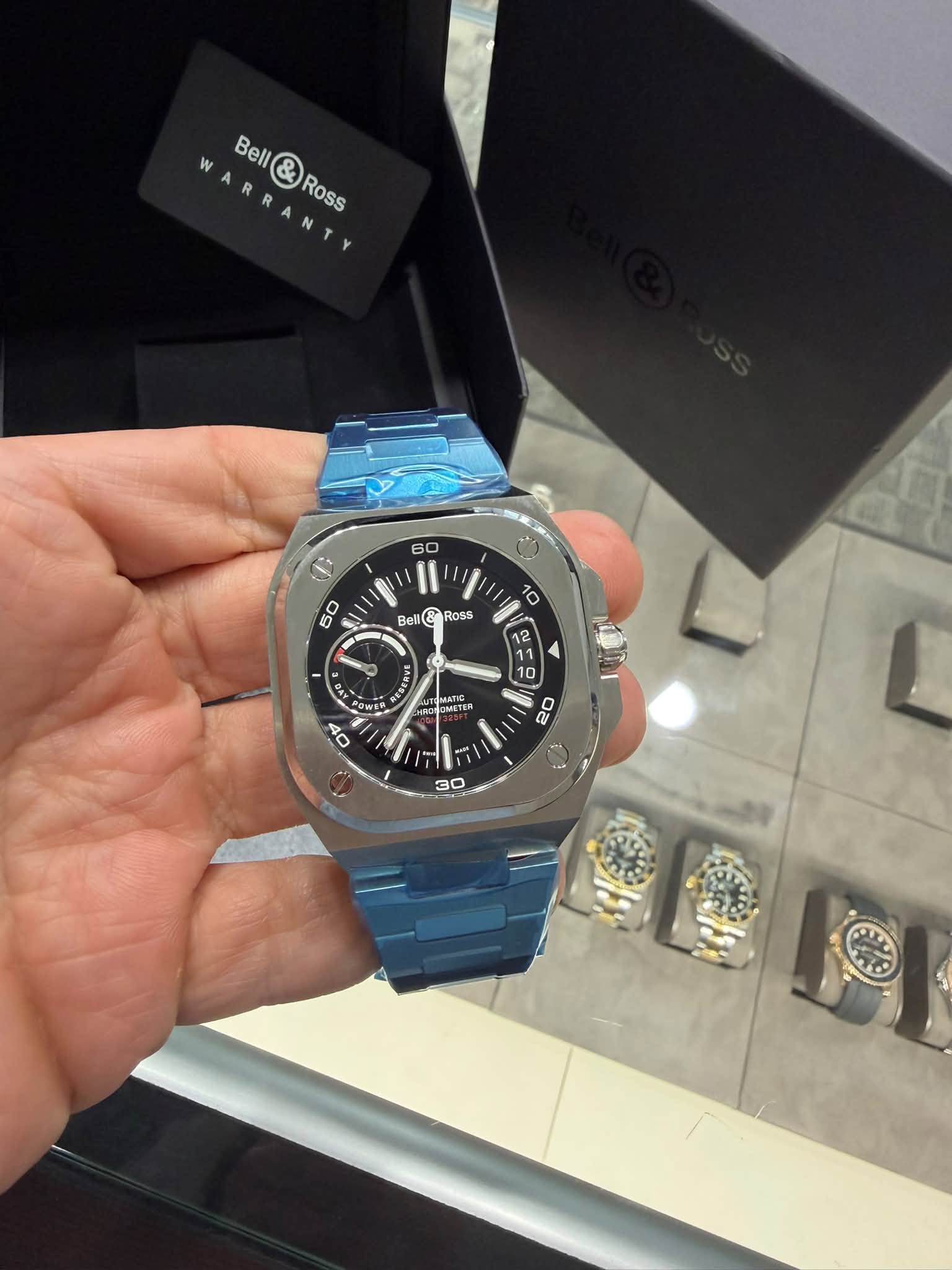 May be an image of wrist watch and text