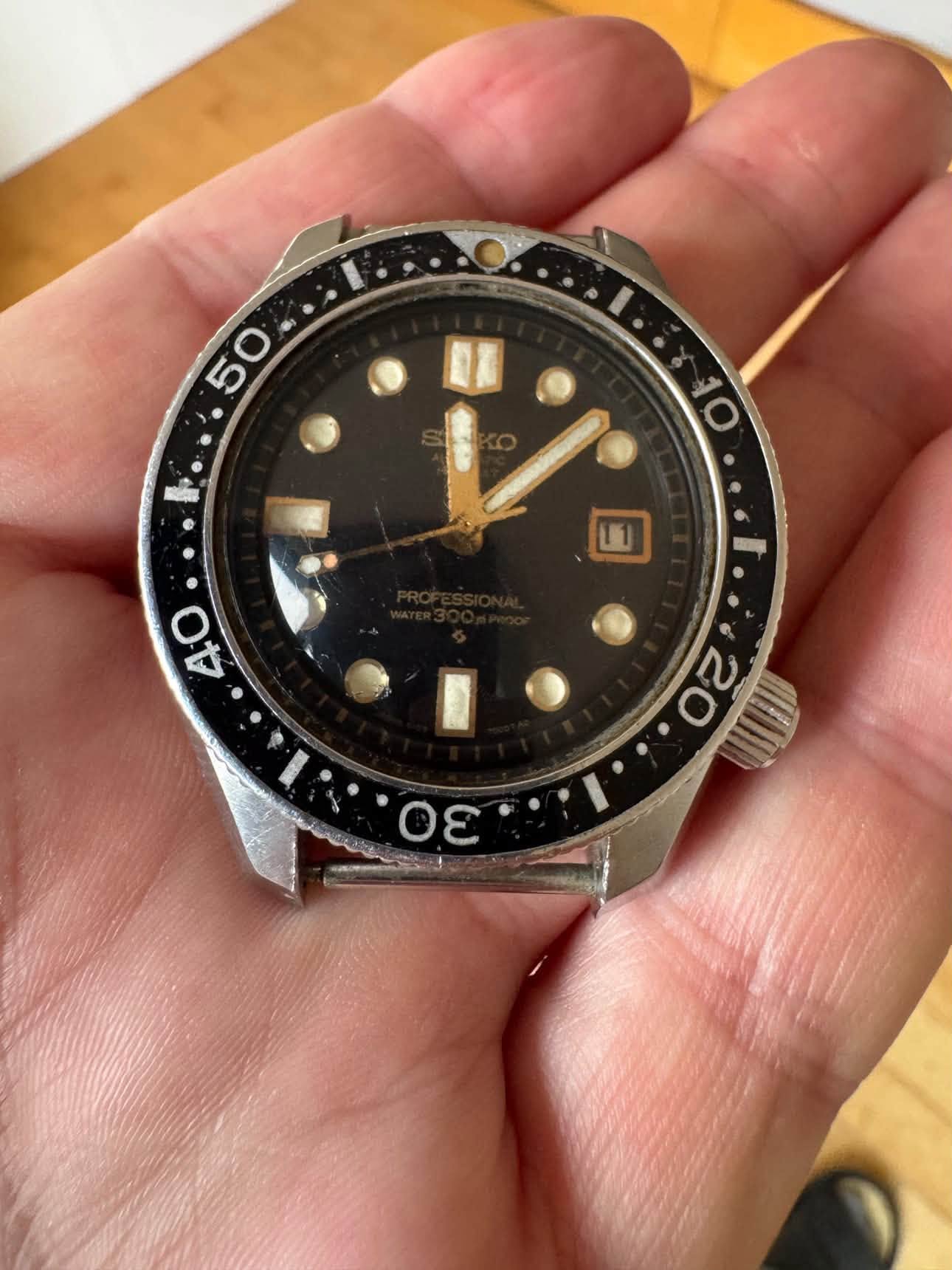 May be an image of wrist watch and text