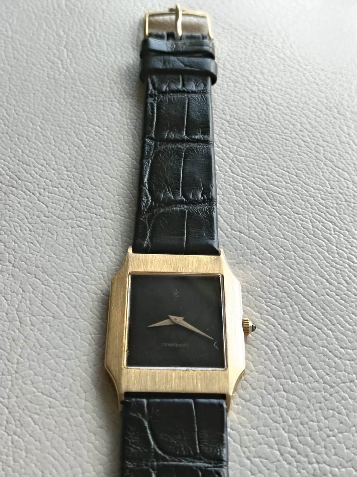 May be an image of wrist watch and leather