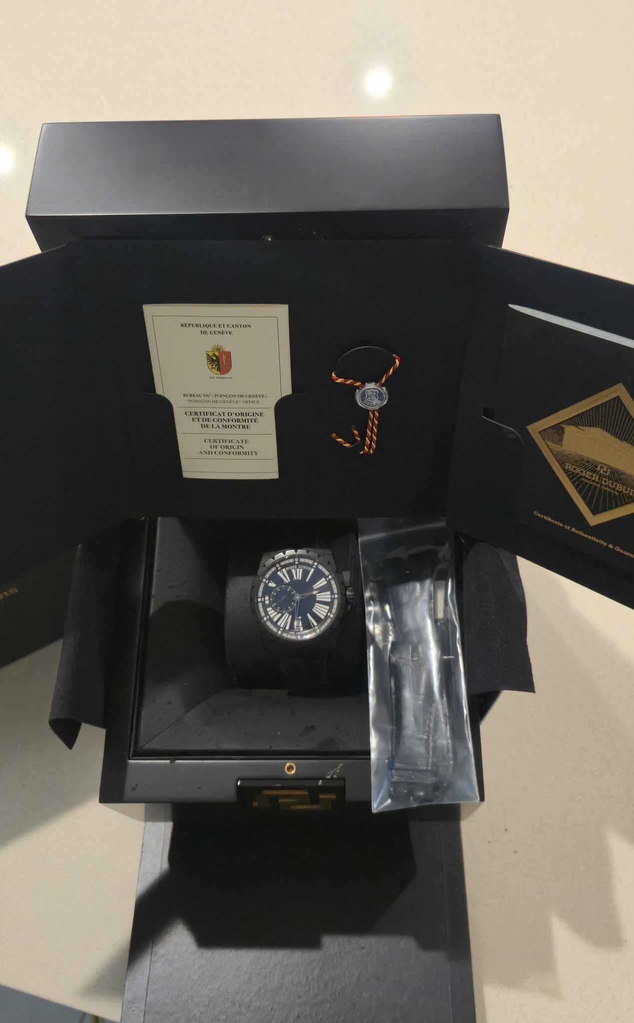 May be an image of wrist watch and text
