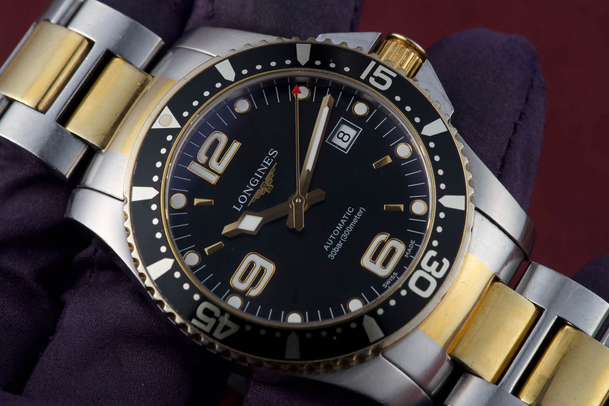 May be an image of wrist watch and text