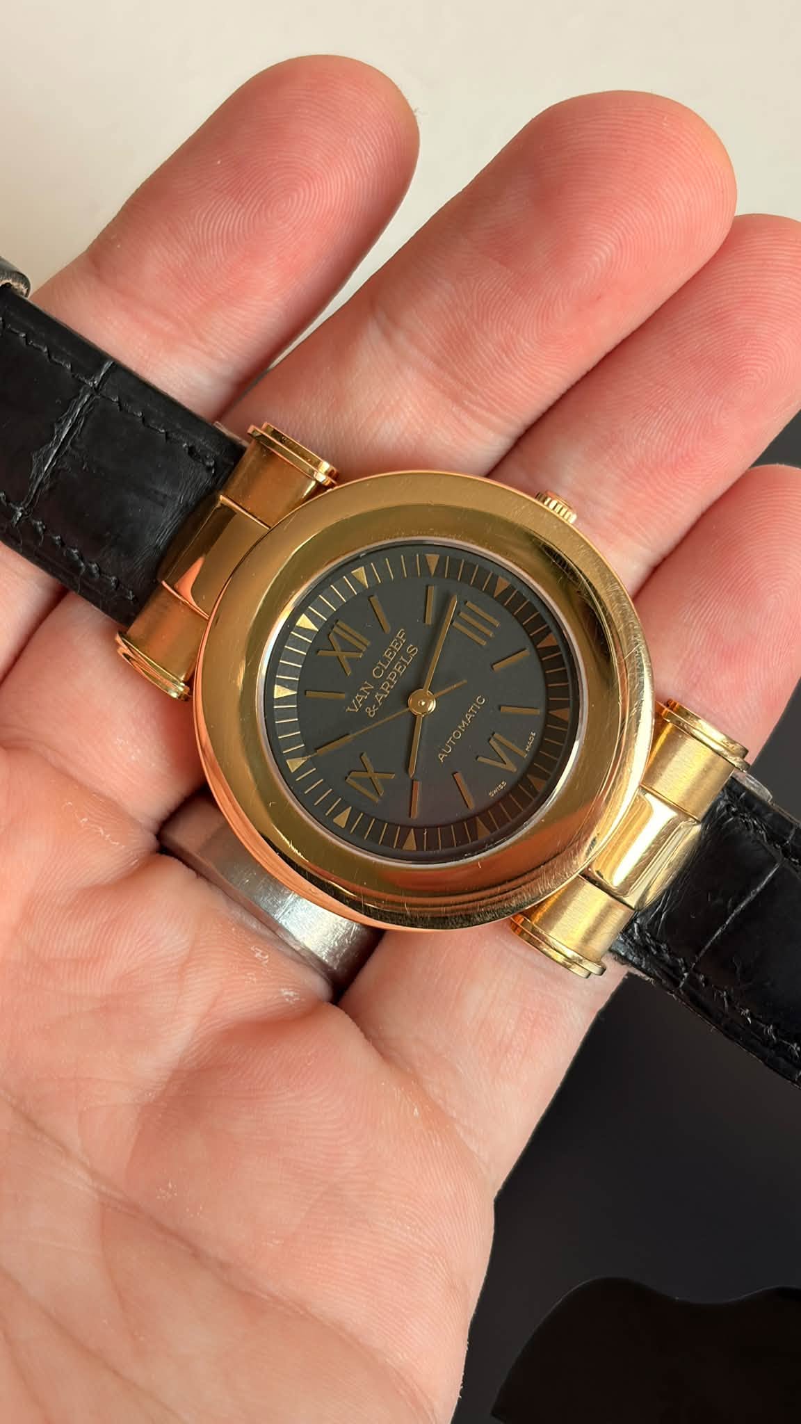 May be an image of wrist watch and text