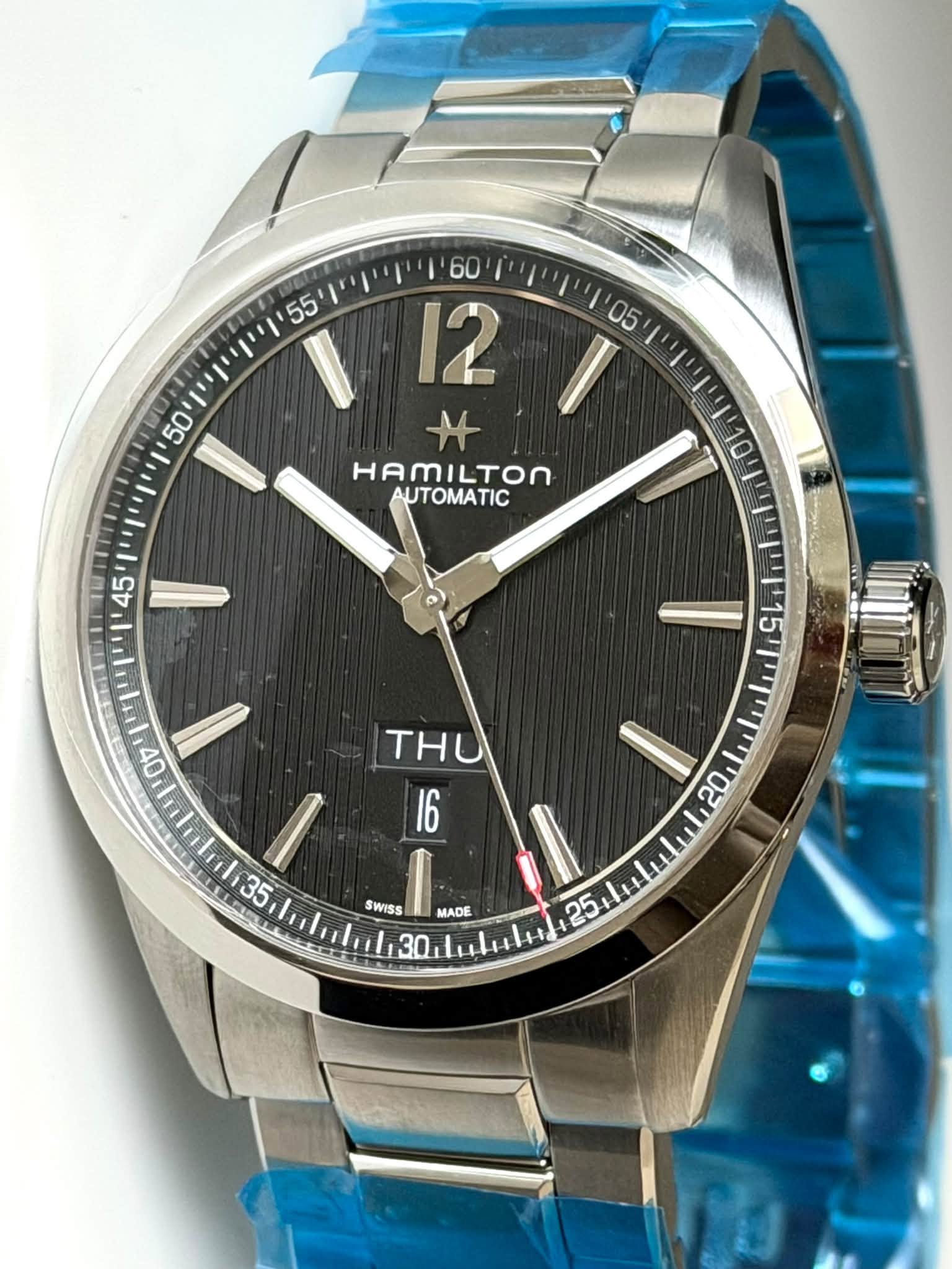 May be an image of wrist watch and text