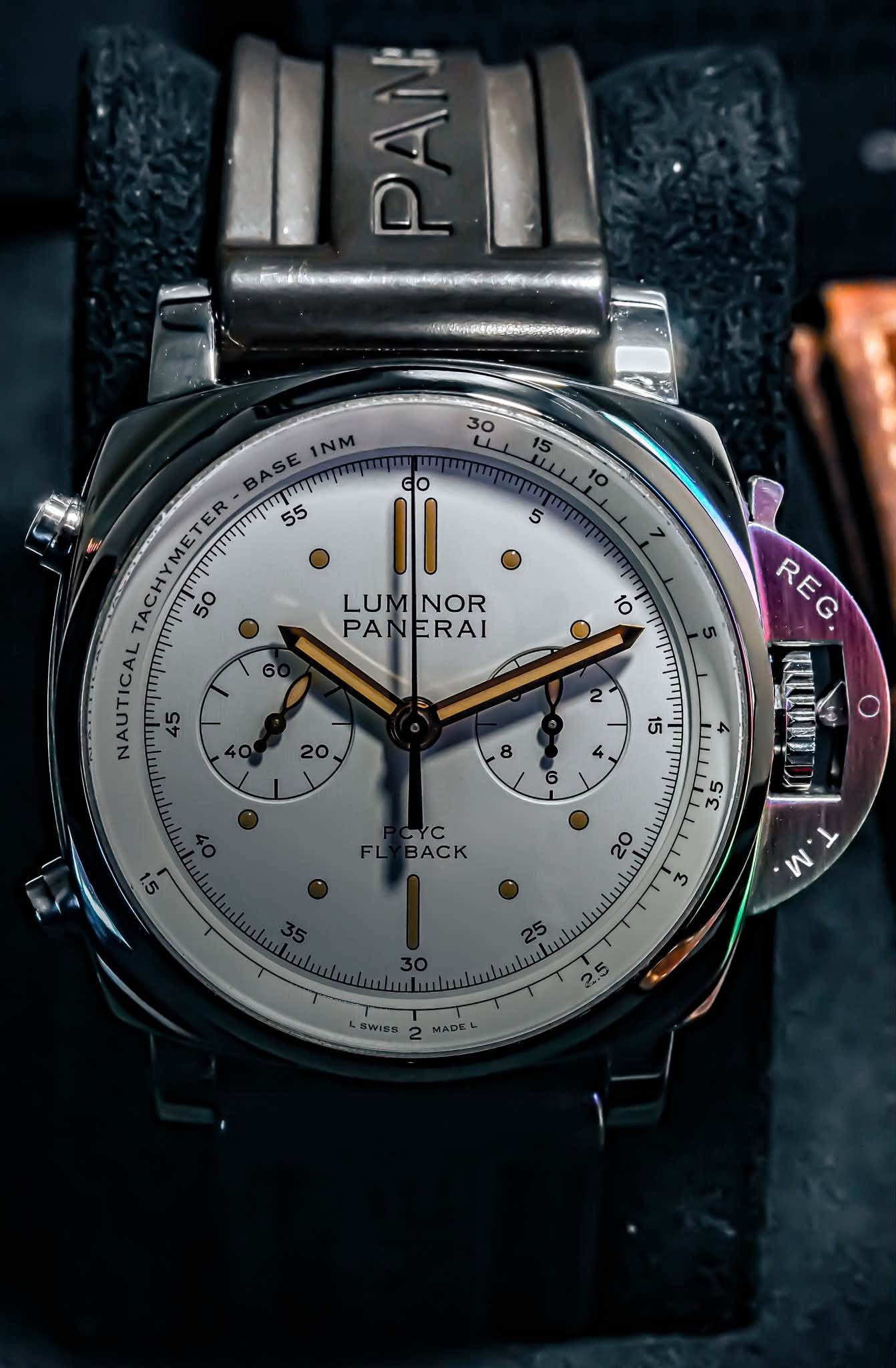 May be an image of wrist watch and text