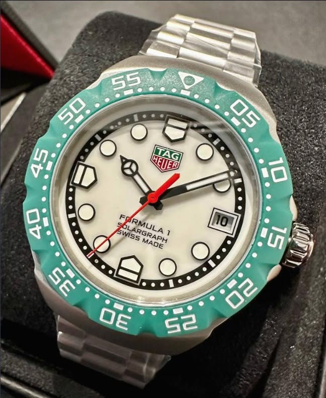 May be an image of wrist watch and text