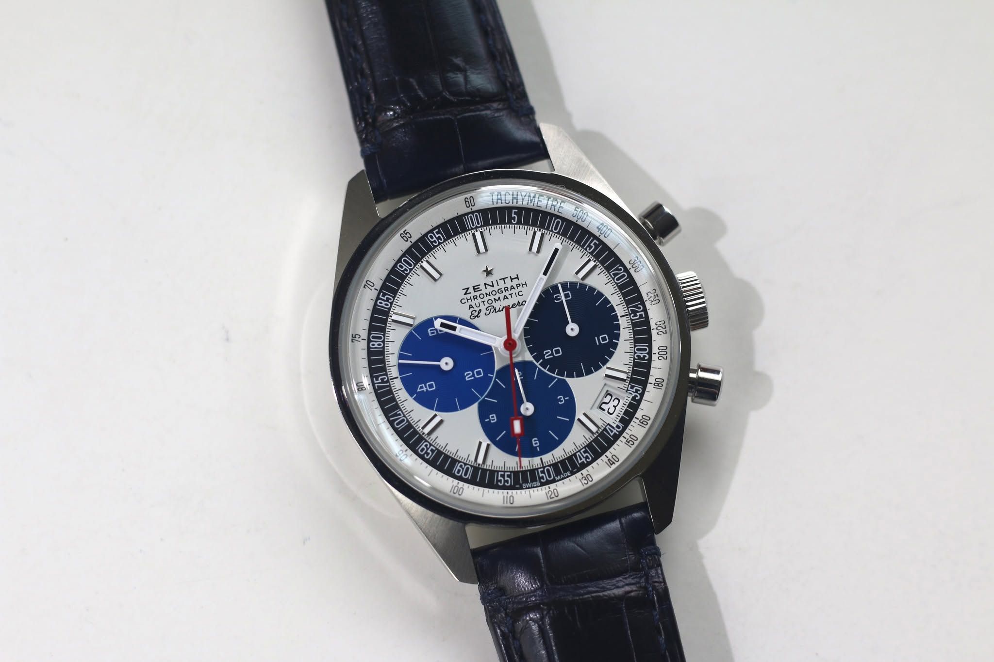 May be an image of wrist watch and text