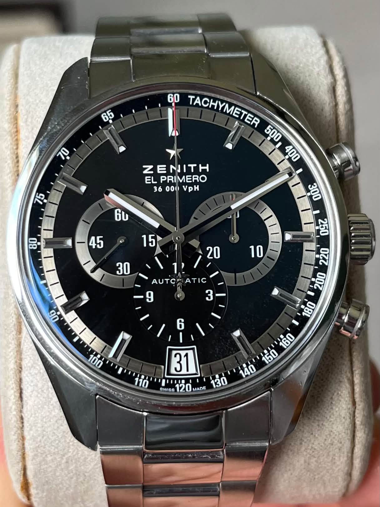 May be an image of wrist watch and text