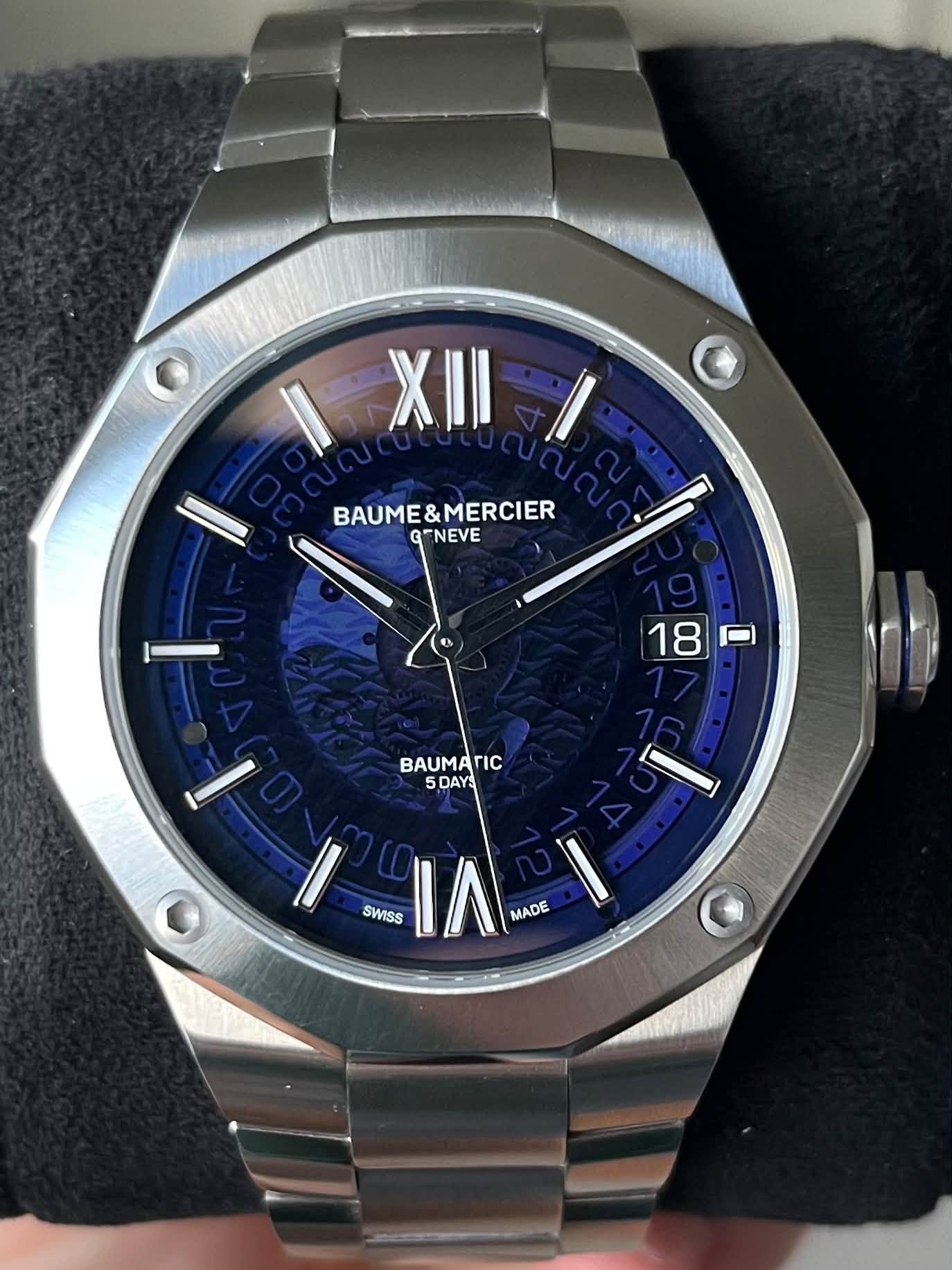 May be an image of wrist watch and text