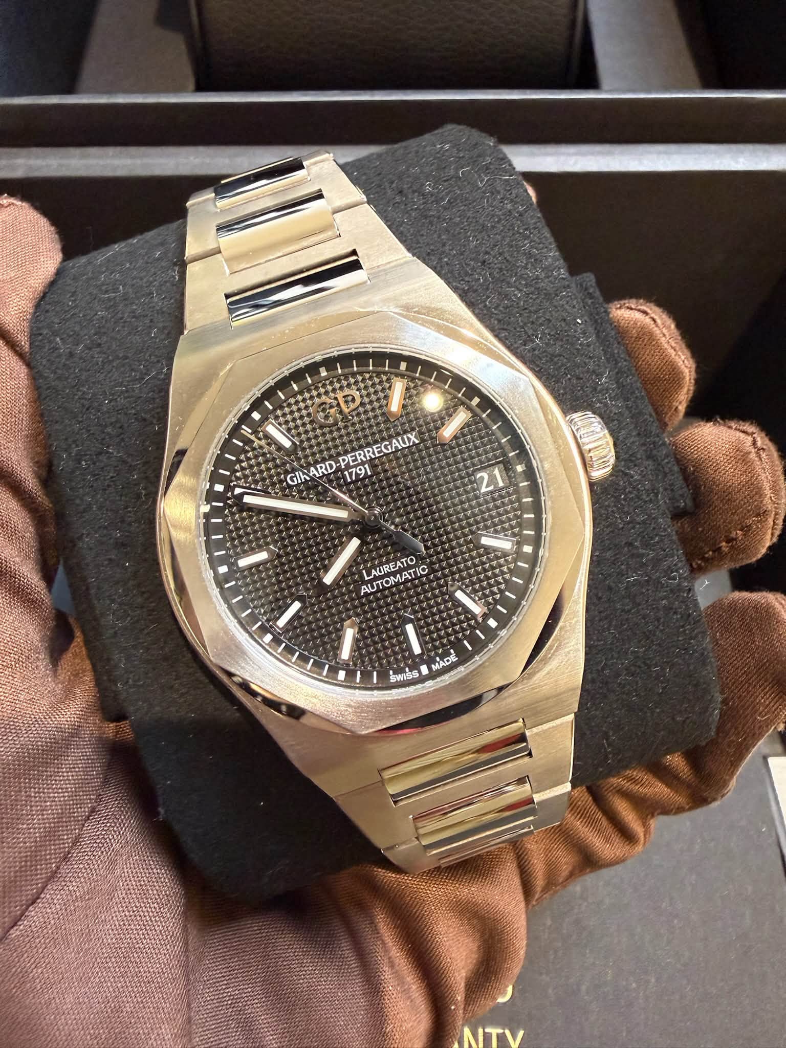 May be an image of wrist watch and text