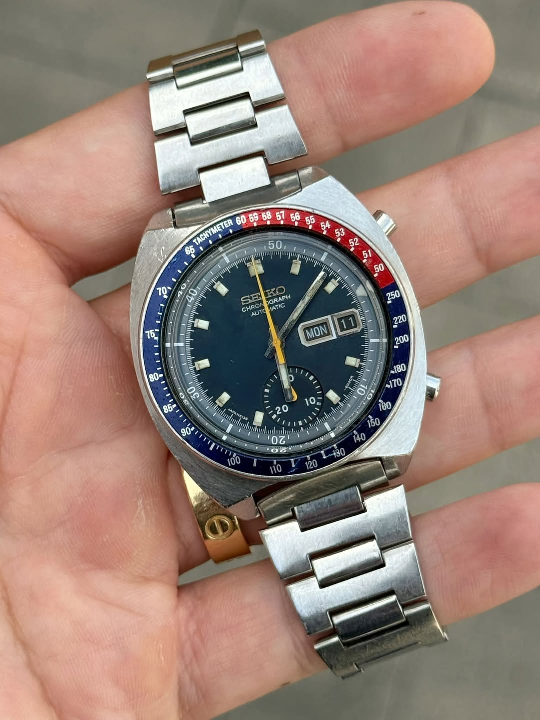May be an image of wrist watch and text