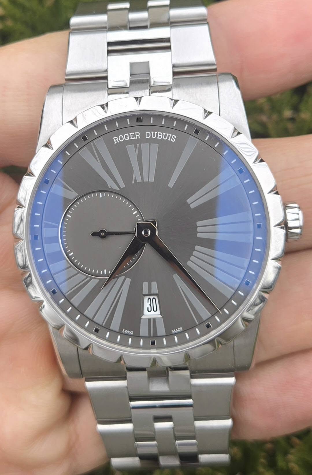 May be an image of wrist watch and text
