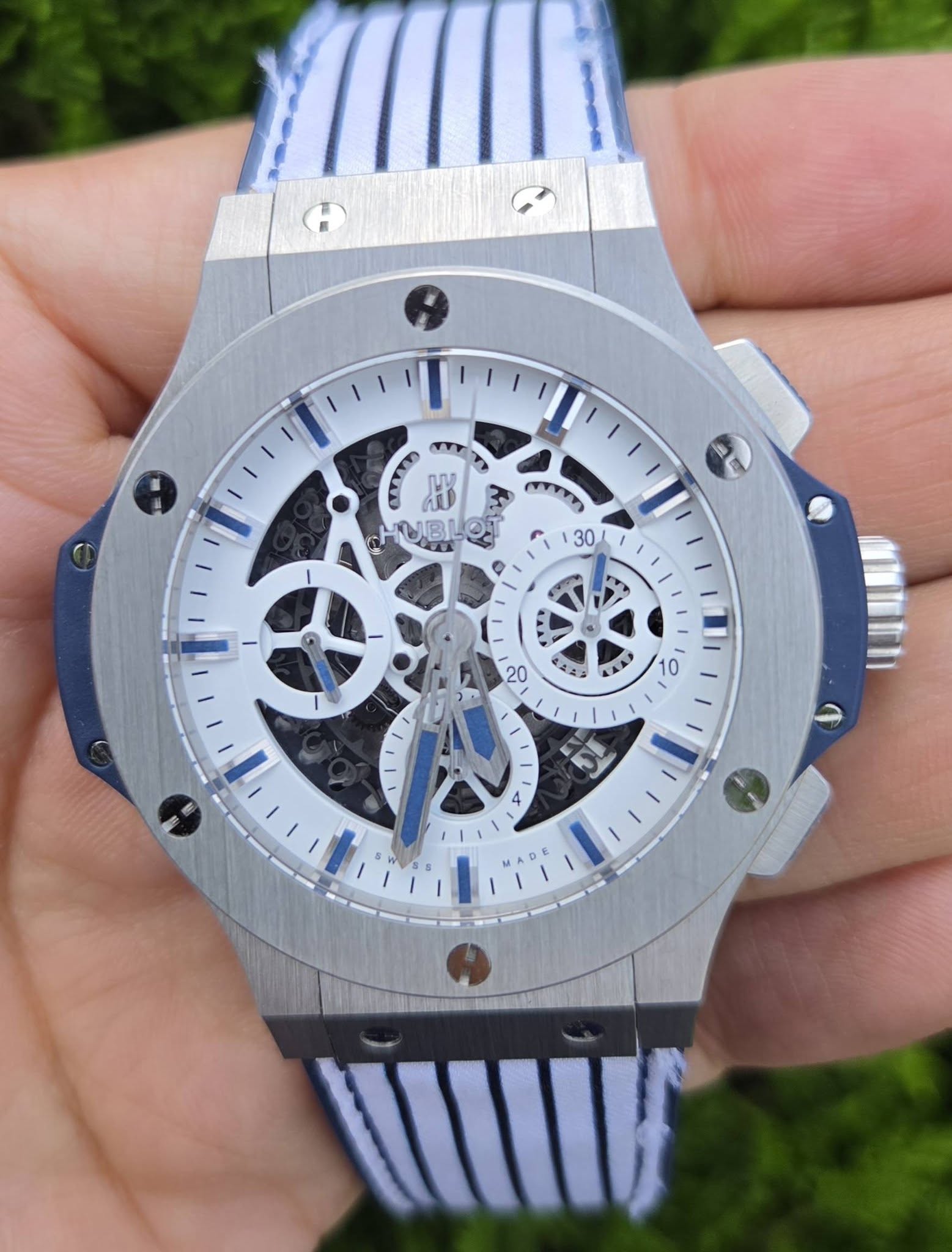 May be an image of wrist watch and text