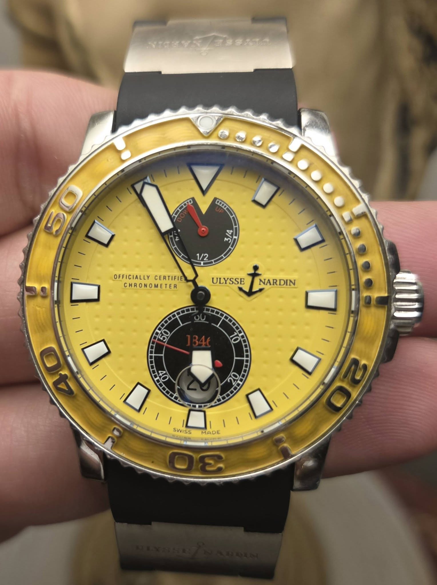 May be an image of wrist watch and text
