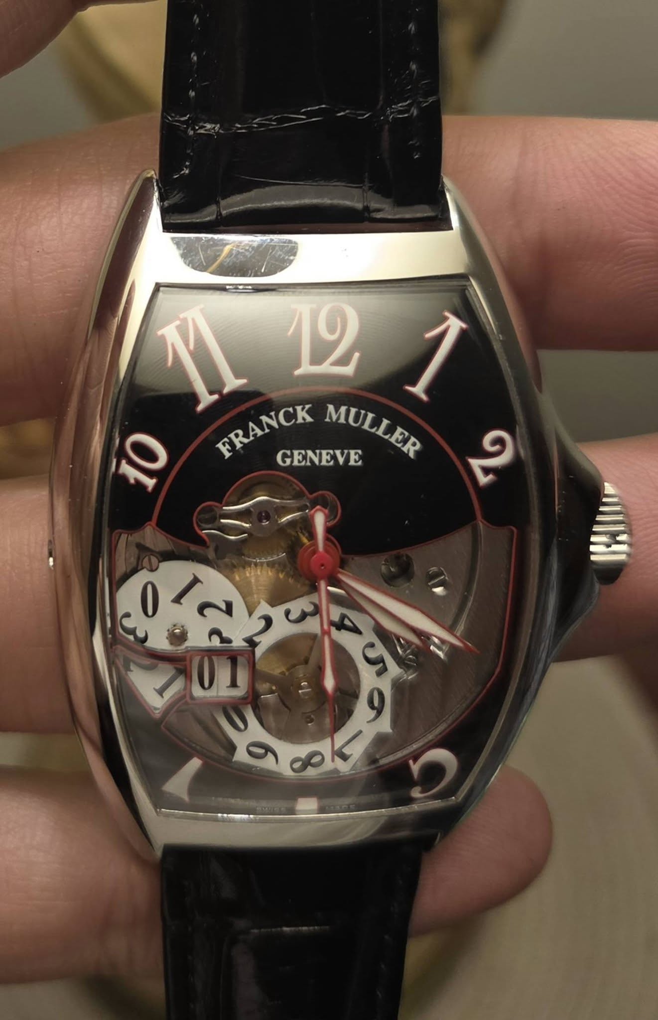 May be an image of wrist watch and text