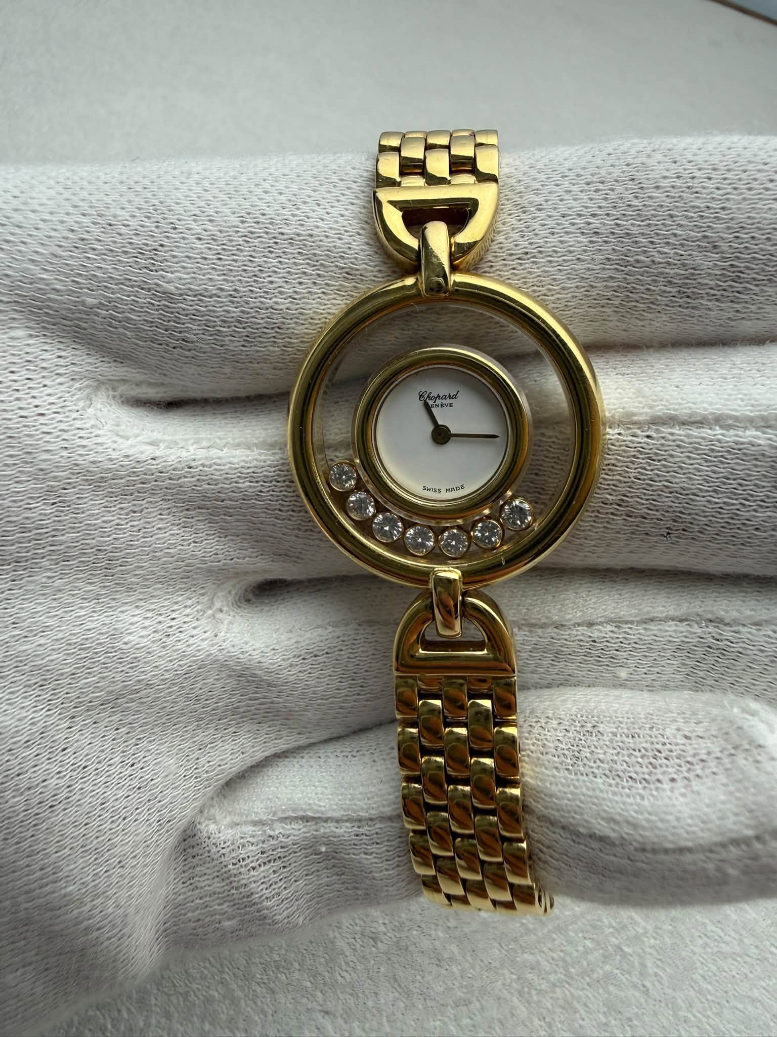 May be an image of jewelry, wrist watch and text