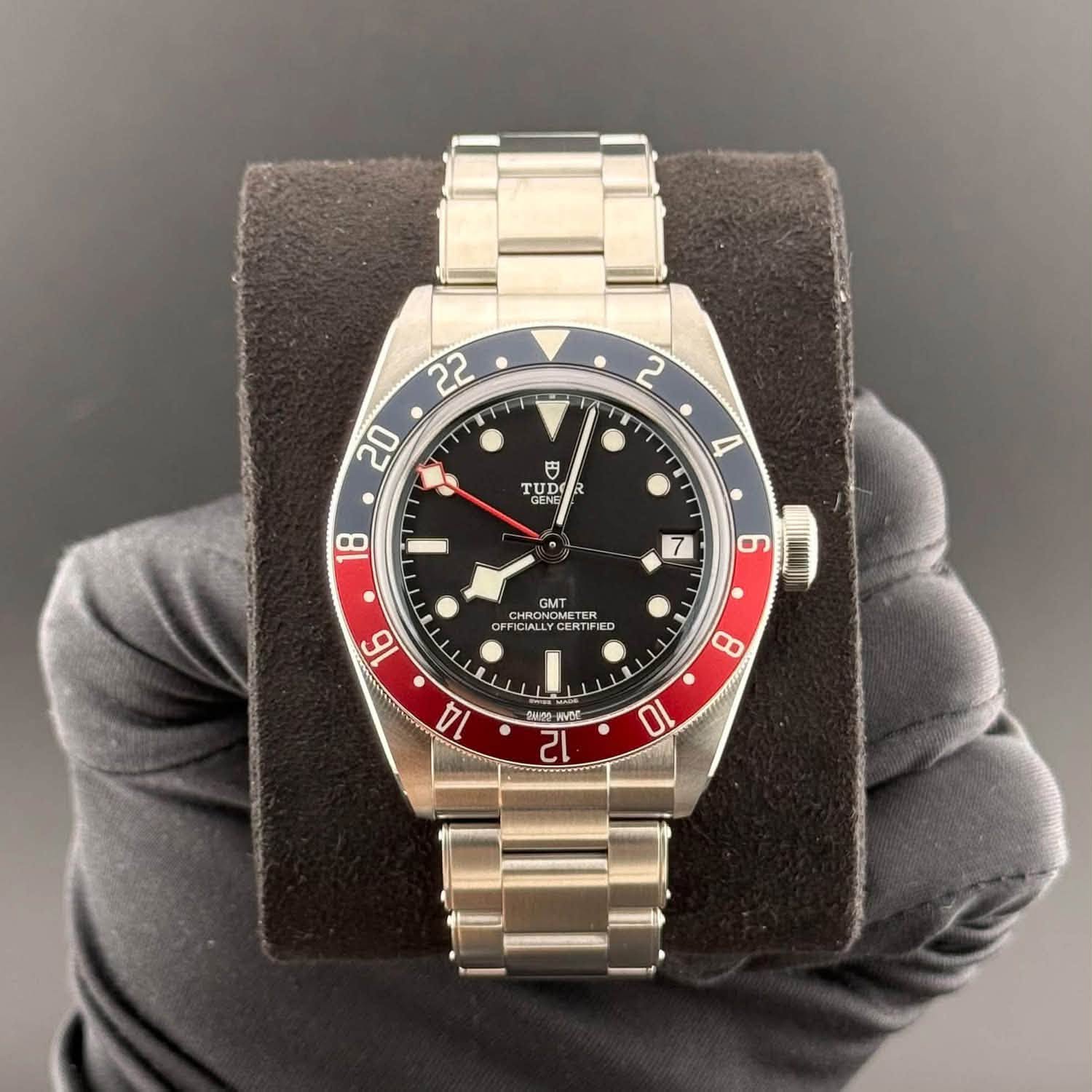 May be an image of wrist watch and text