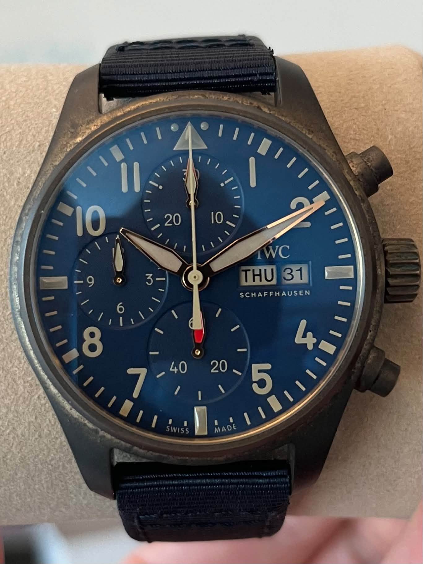 May be an image of wrist watch and text