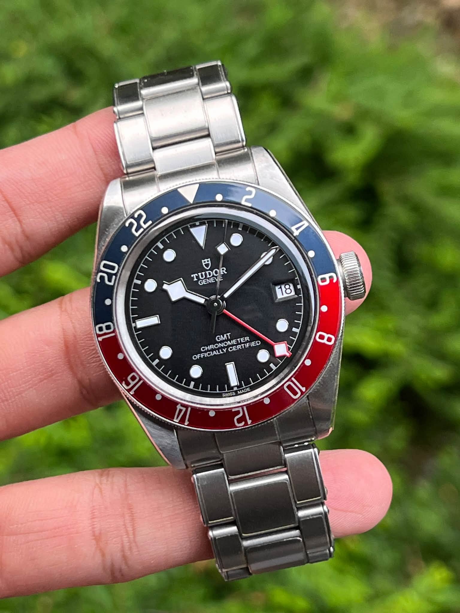 May be an image of wrist watch and text