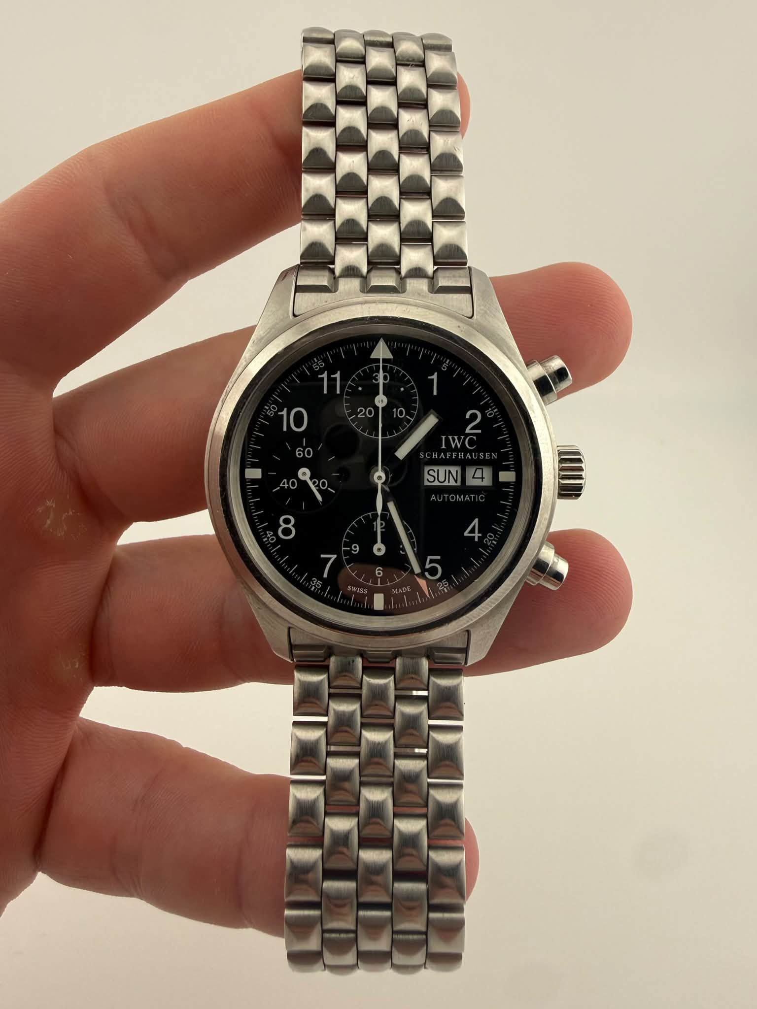 May be an image of wrist watch and text
