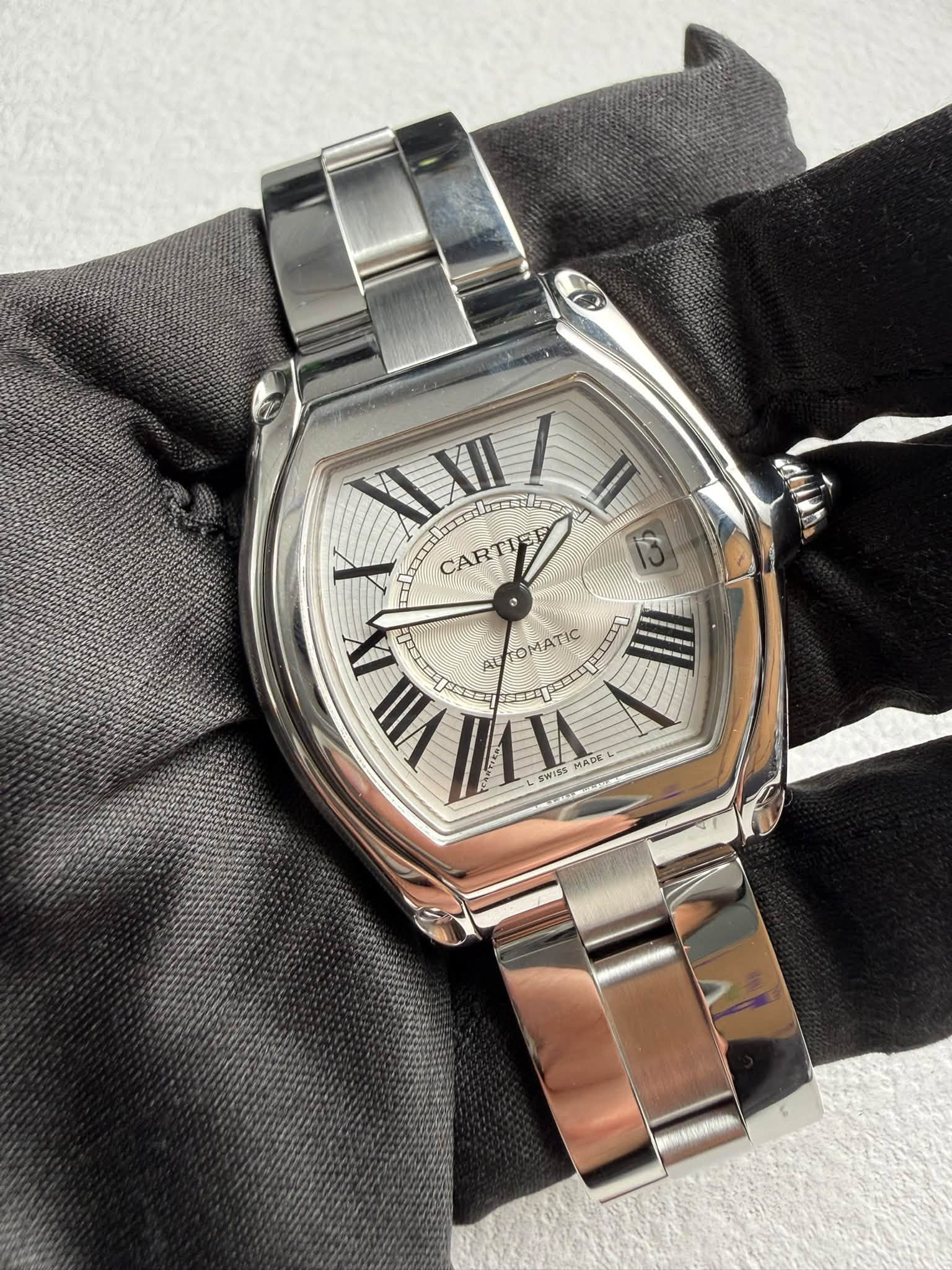 May be an image of wrist watch and text