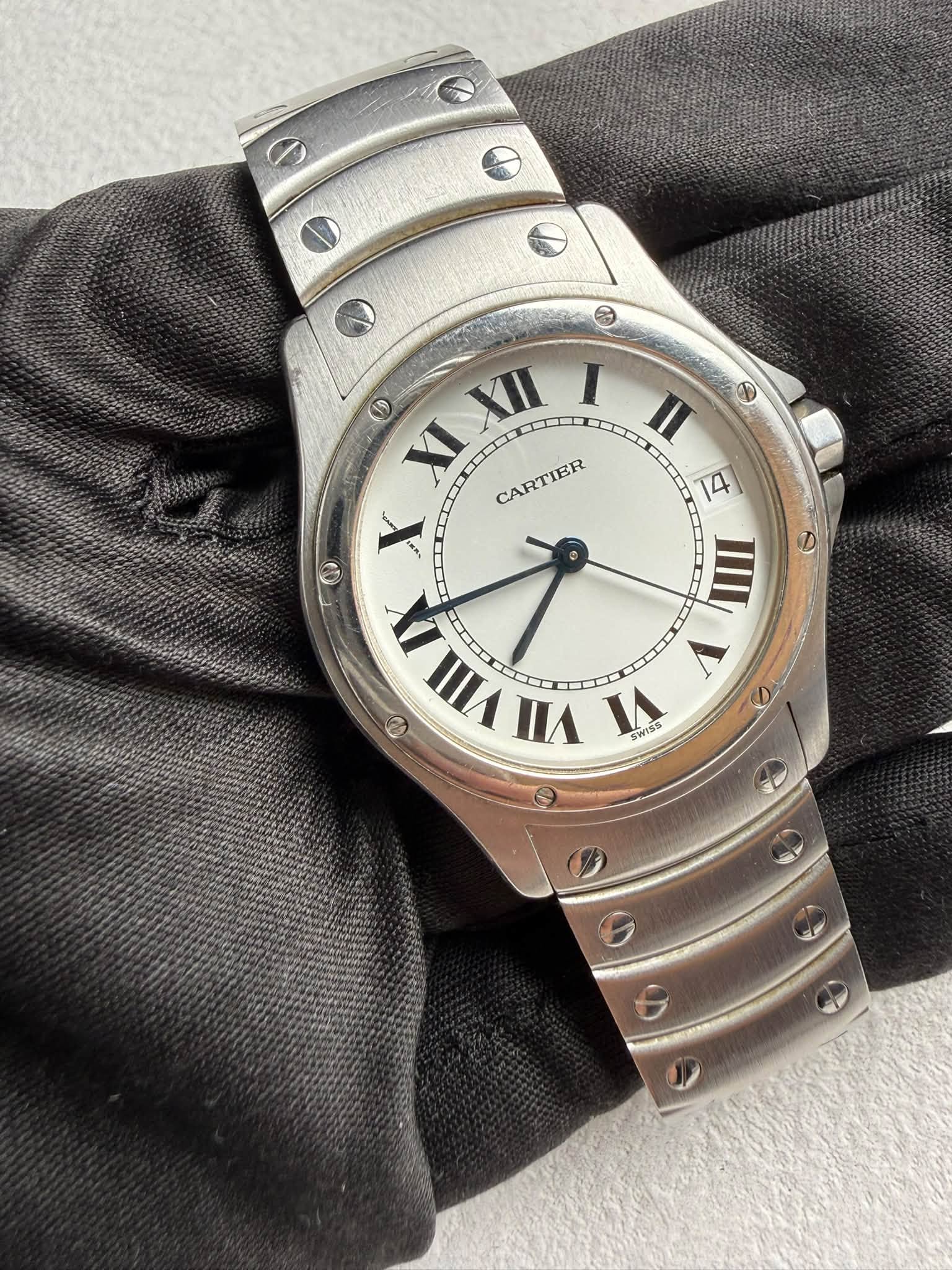 May be an image of wrist watch and text