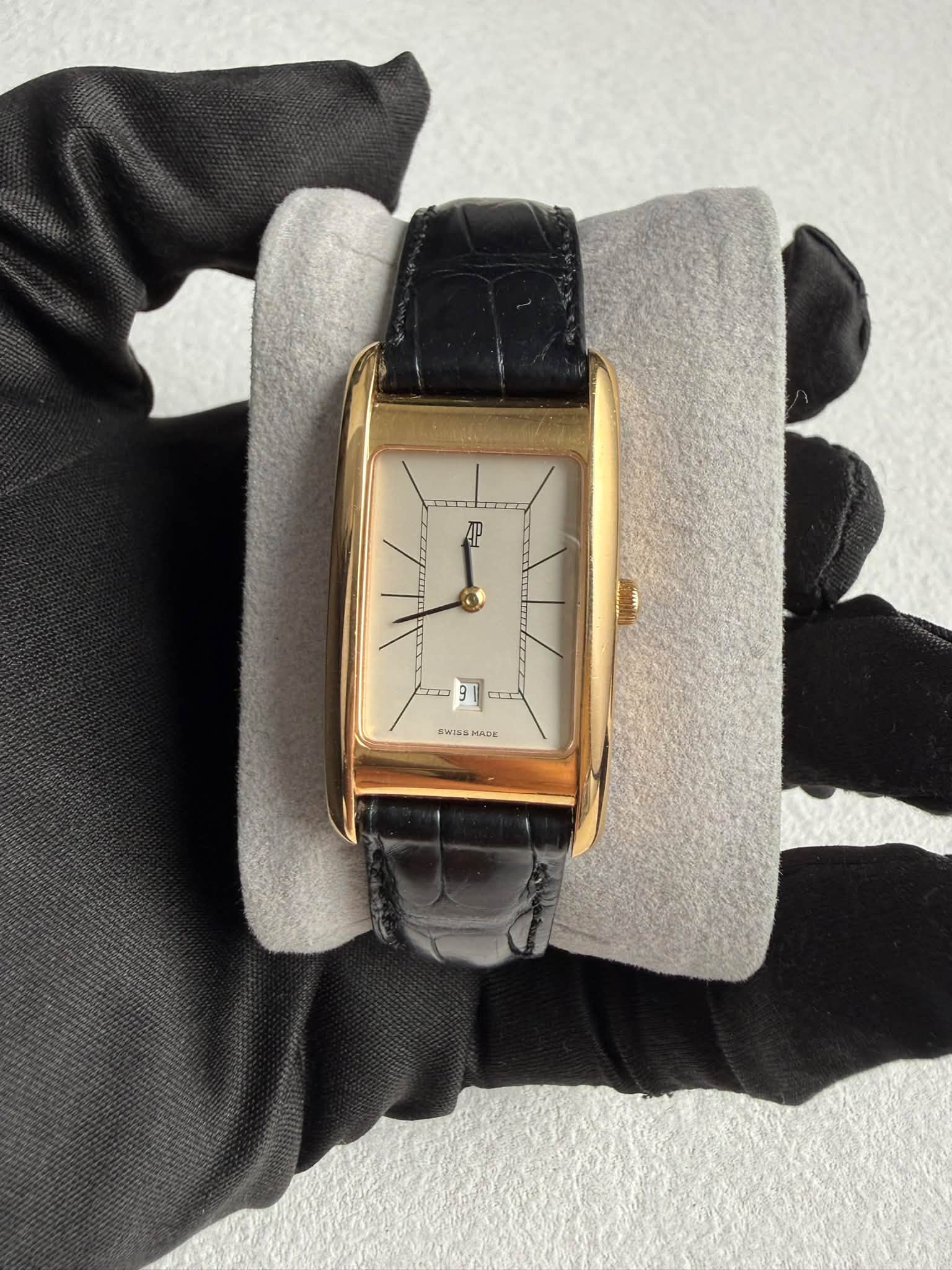 May be an image of wrist watch and text