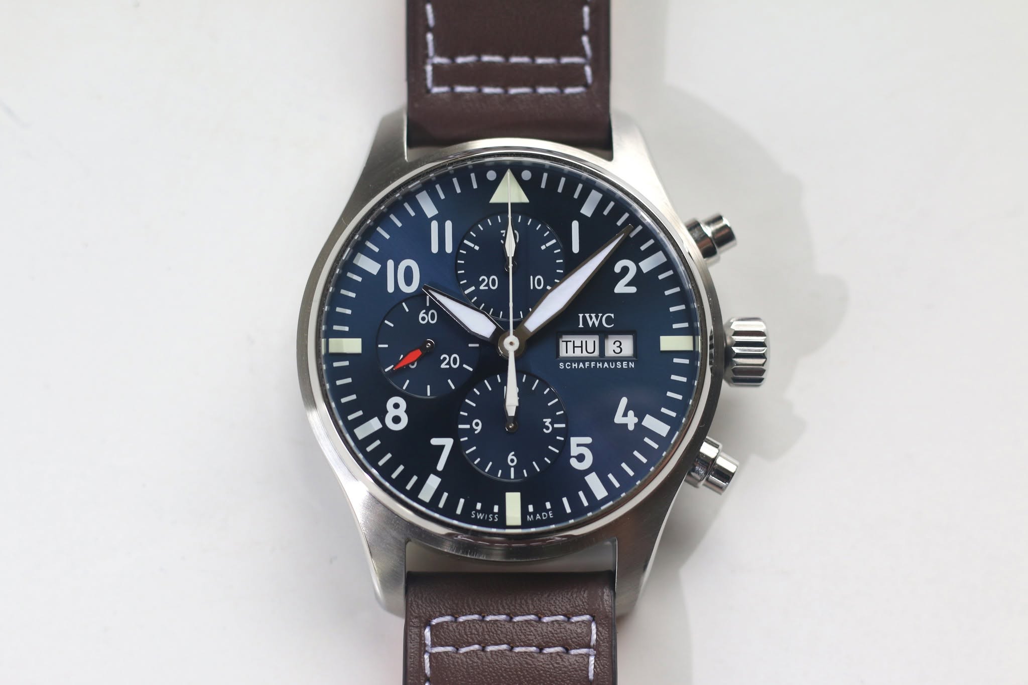 May be an image of wrist watch and text