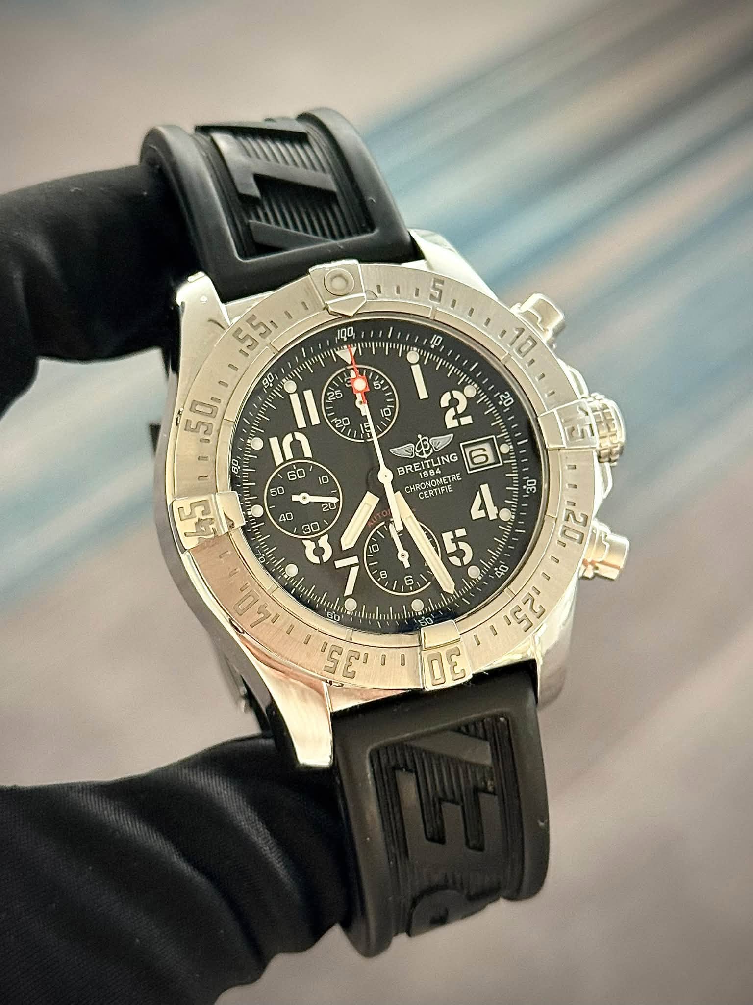 May be an image of wrist watch and text