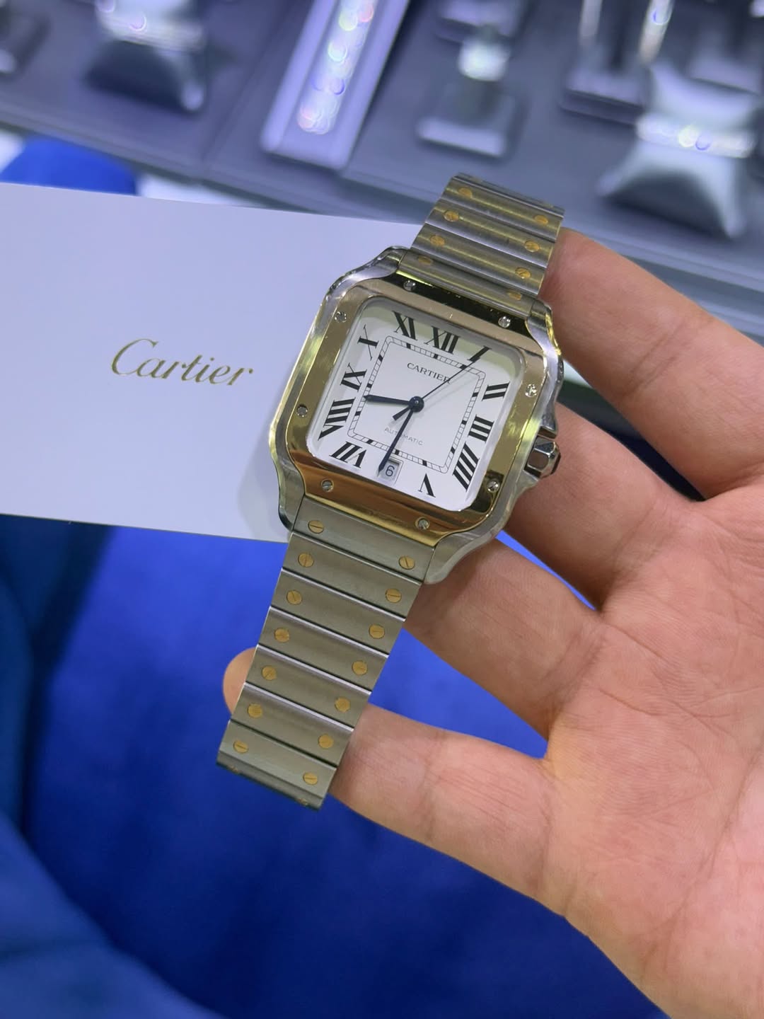 May be an image of wrist watch and text