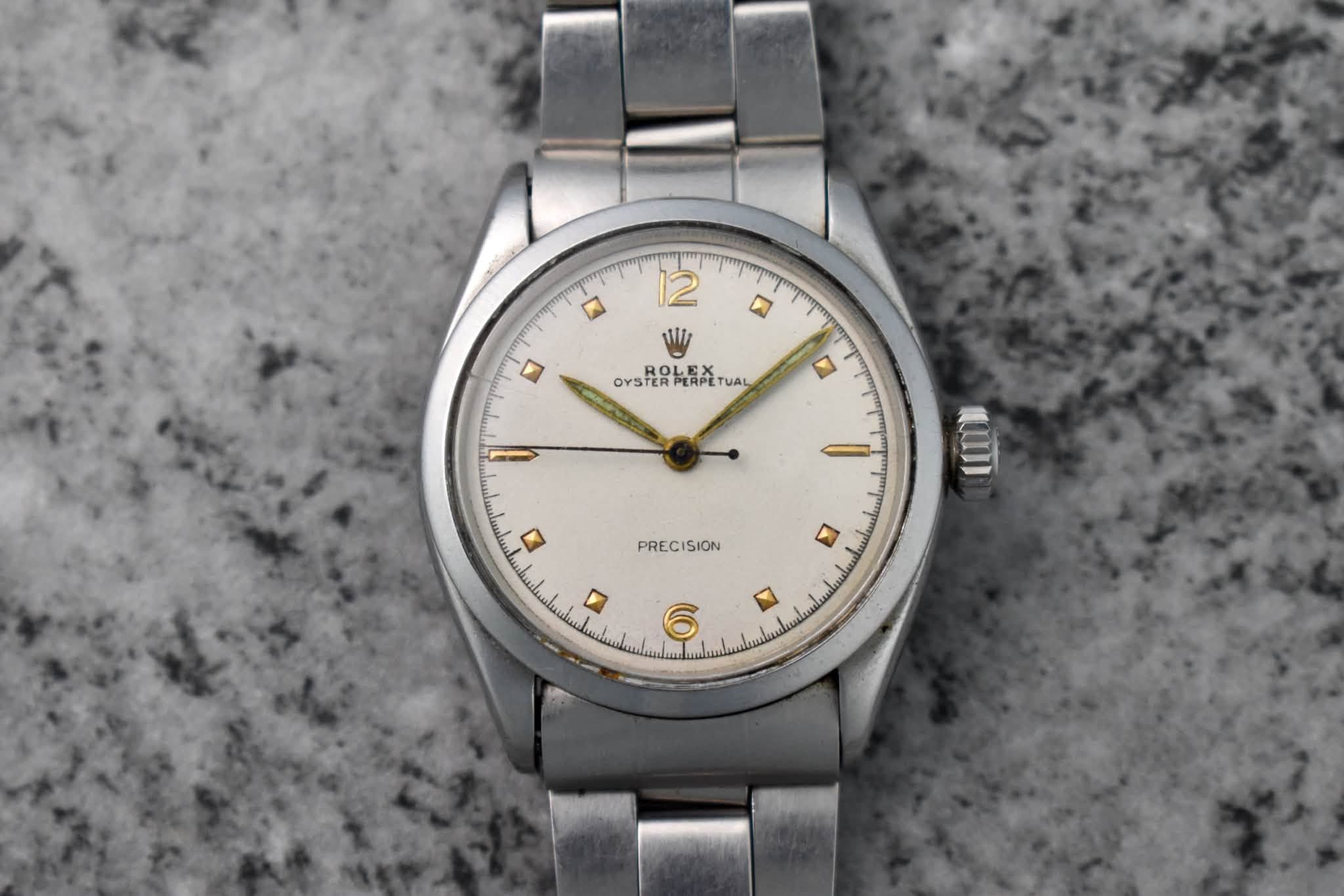 May be an image of wrist watch and text