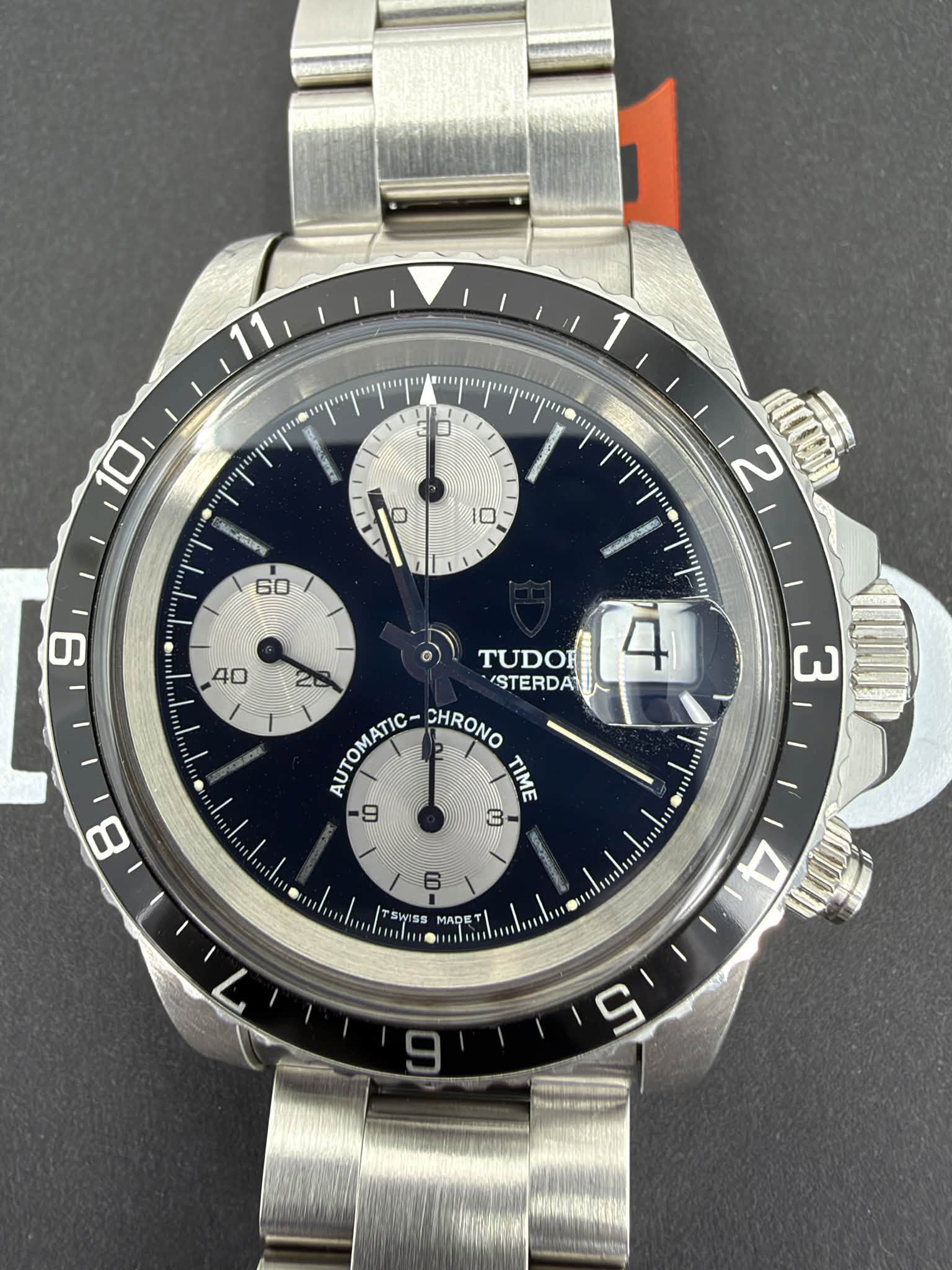 May be an image of wrist watch and text