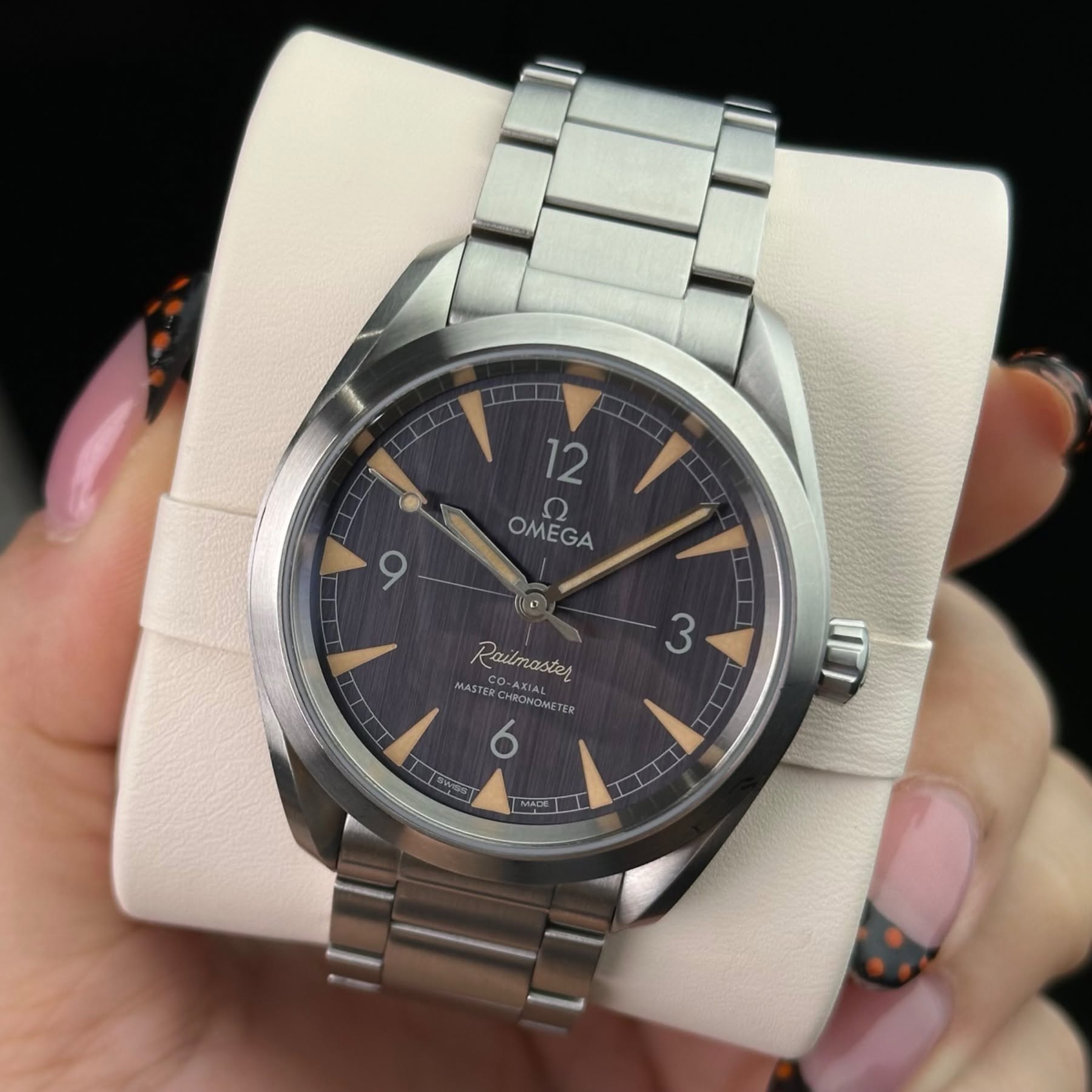 May be an image of wrist watch and text